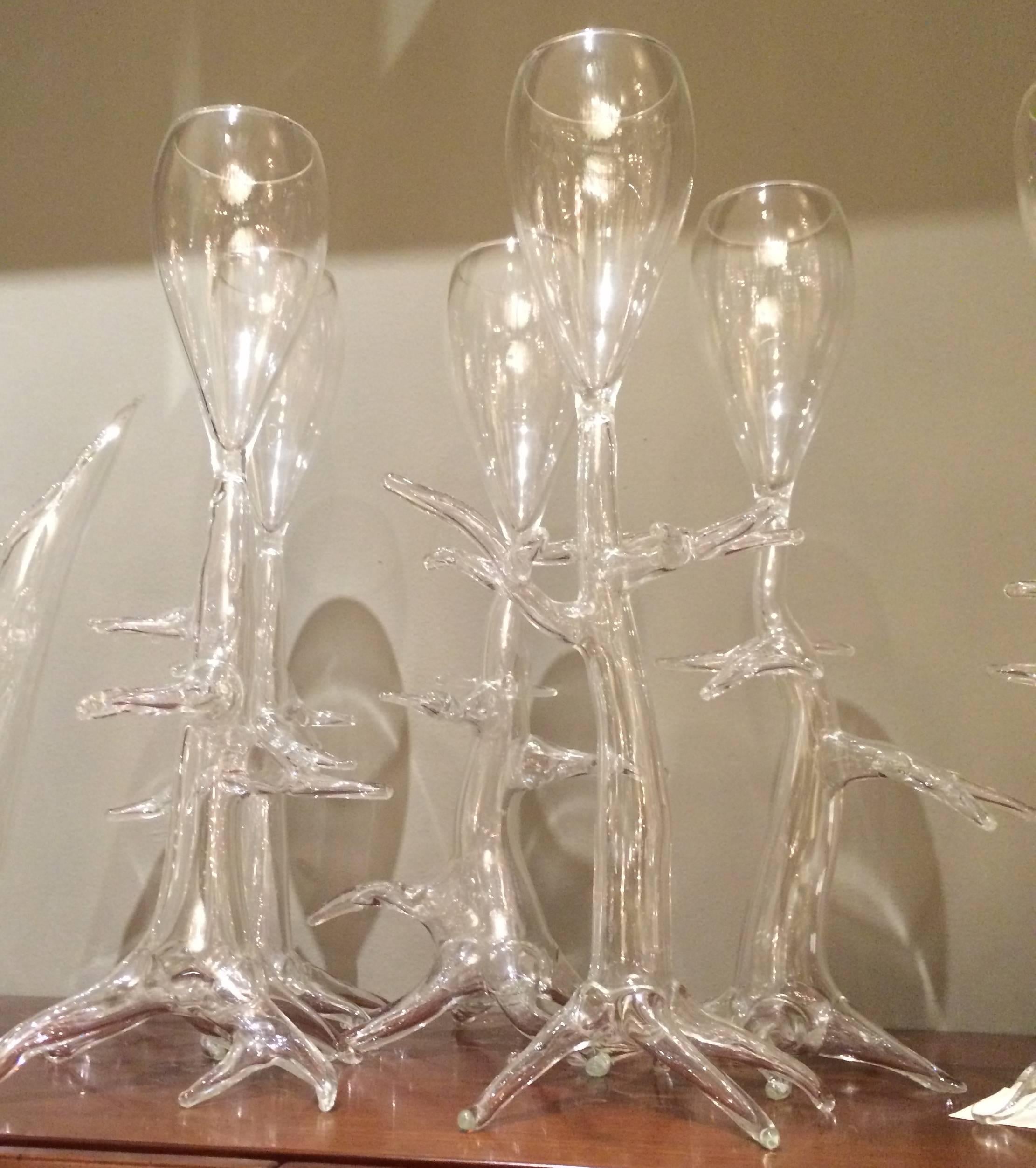 Handblown clear glass vessels with branching, arboreal shafts, created by the contemporary glass artist Crestani, each signed and dated. 
Measures: Glass height 14”.   Pitcher height 13”, width 13”, depth 7”.

OUR REFERENCE N6424