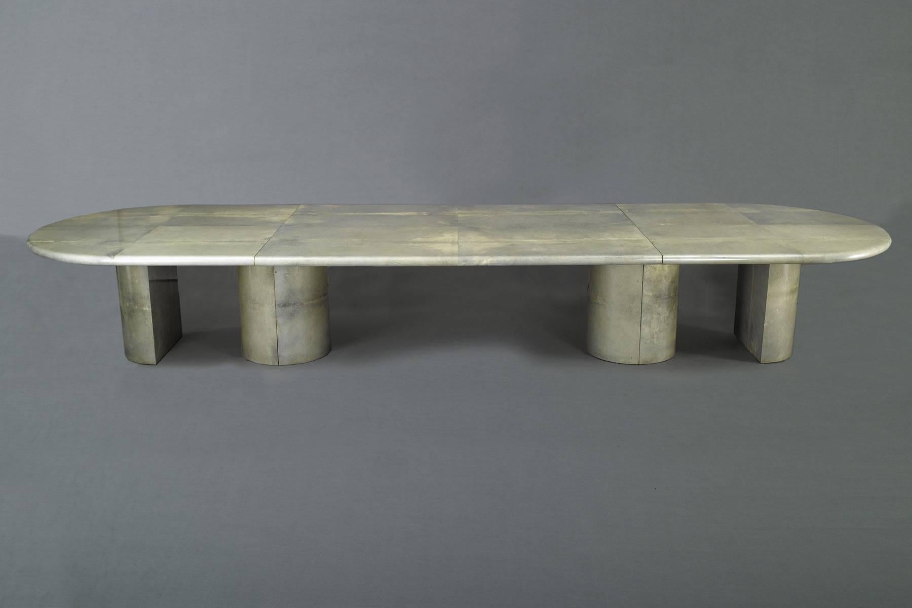 Lacquered goatskin over wood, composed of two sections with semi-circle end columns and one circular central column. Original Tura label intact.
Measures: Length 110”, Width 55”, height 30”.
Additional middle section: 78.75