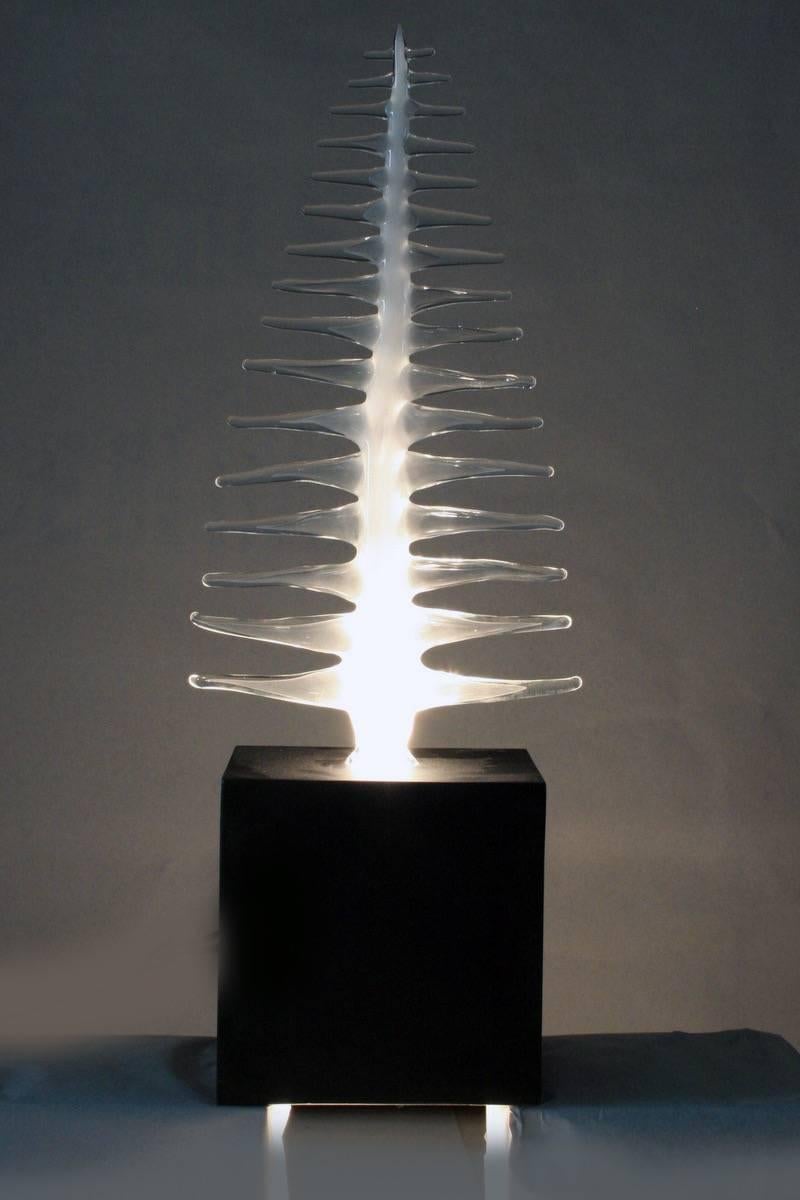 Fire-worked glass frond composed of a translucent, milky glass spire issuing numerous clear glass points; held in a black-patinated metal box, which houses an uplight. Limited Edition 1/6.

OUR REFERENCE N8452
