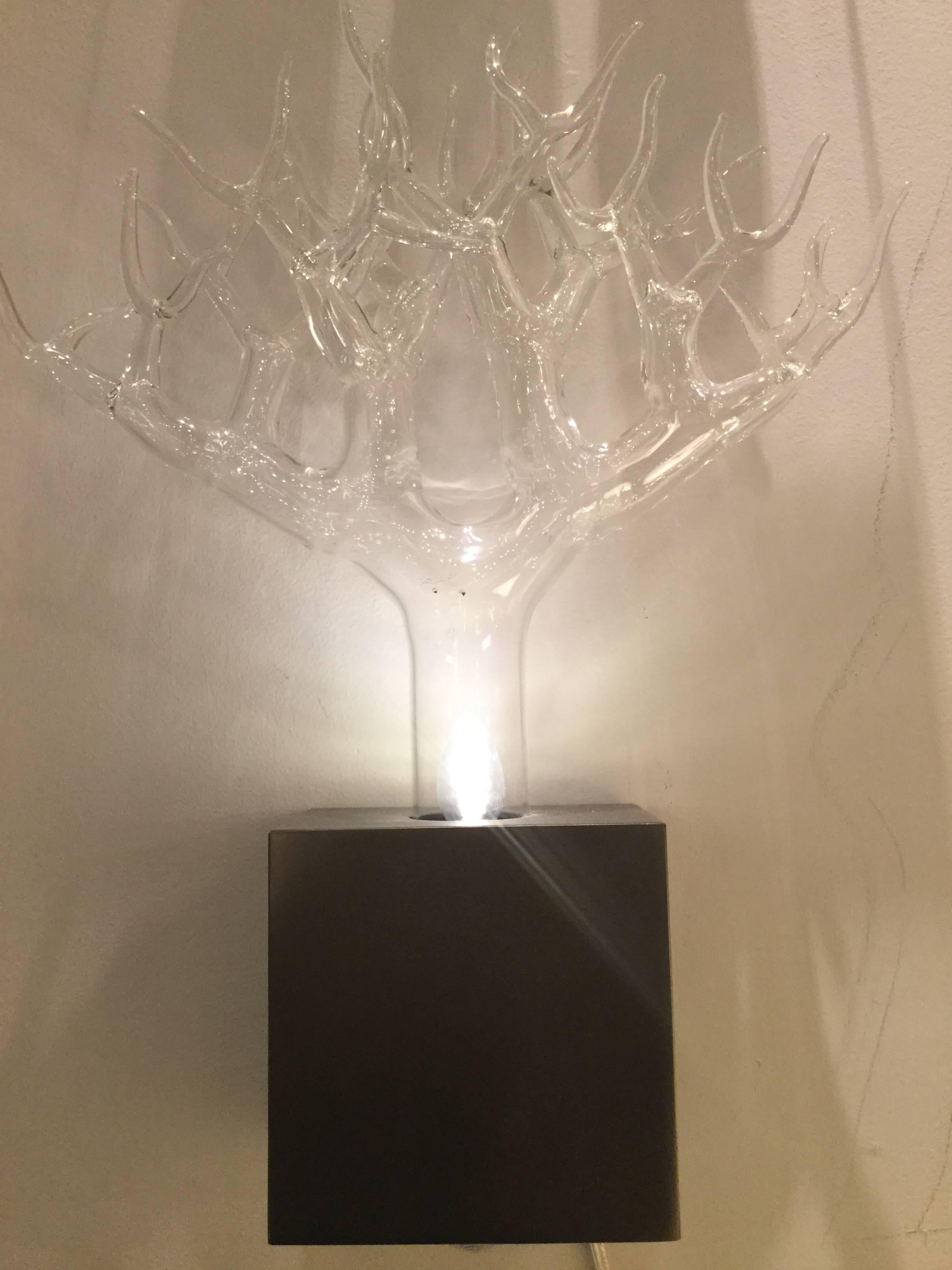 Fire-worked glass, composed of clear forking branches, issuing from a dark-pewter finished box, housing an uplight. Engraved signature on the glass. 

OUR REFERENCE N9337
