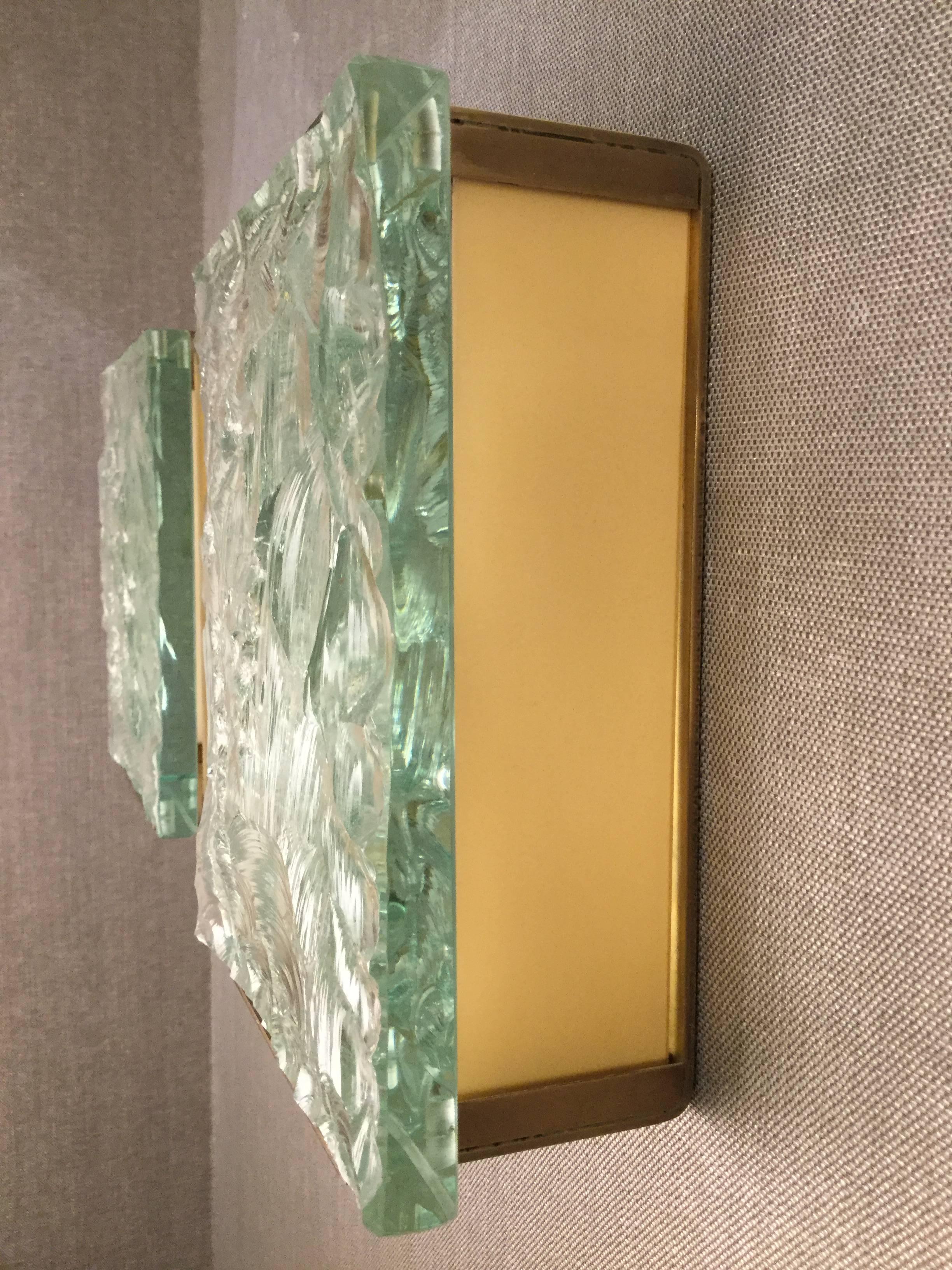 Clear chiseled glass panel mounted on a rectangular brass structure.
Model: 2311 Literature: “Quaderni di Fontana Arte”, n 6,1964, p.76.

OUR REFERENCE N10395a