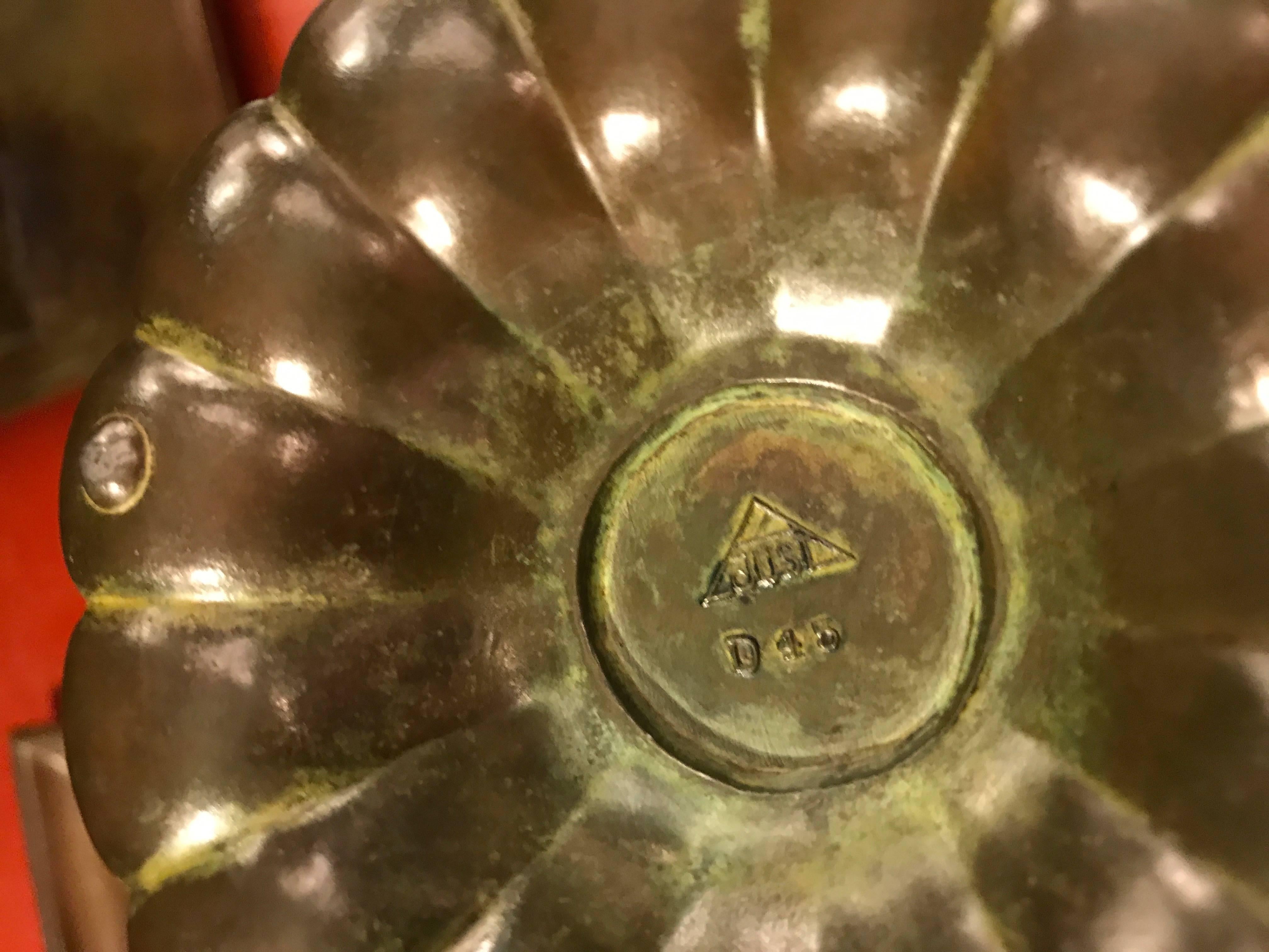 Patinated diskometal, Andersen’s signature alloy, with a hinged cap, glass well, and shallow scalloped basin. Marked on the underside with Andersen’s monogram and model number.

OUR REFERENCE N6681