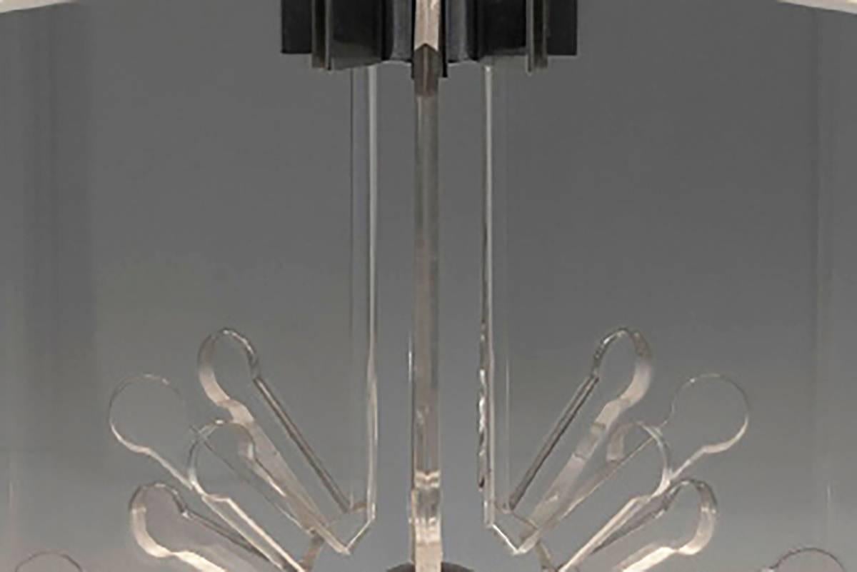 
Openwork Perspex lamps in a chrome frame, model number 524. Original Arteluce label partially intact.

