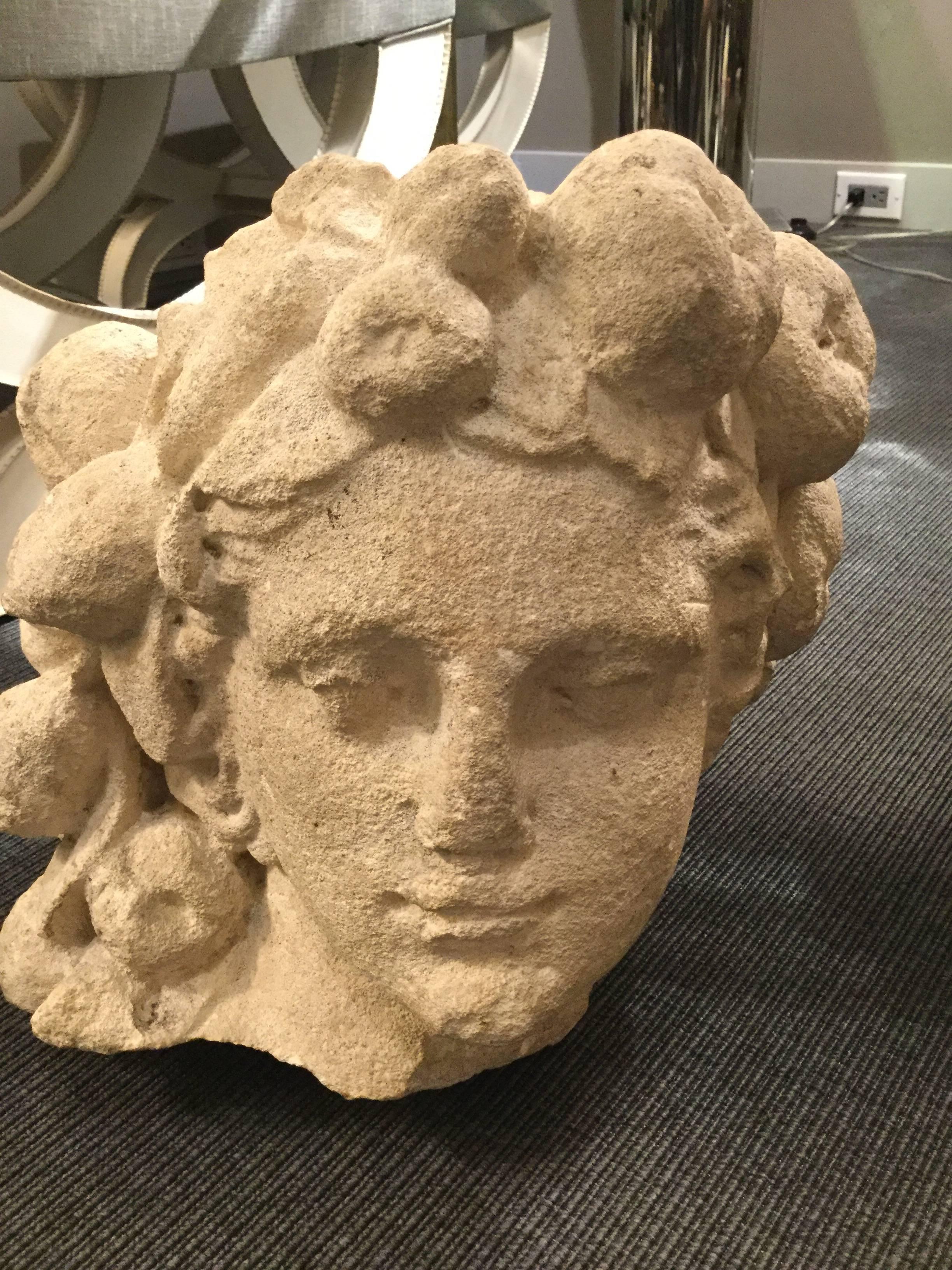 Stone sculpture depicting Pomona, Goddess of fruitful abundance in ancient Roman mythology.
 