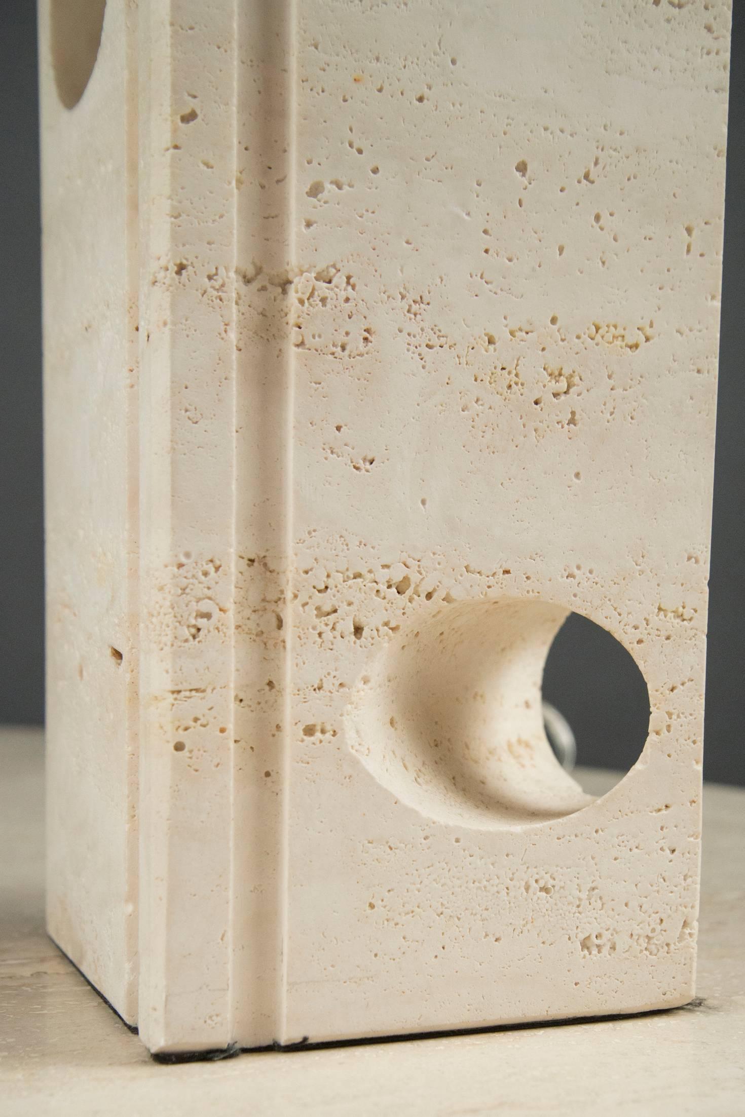 Travertine lamps, each composed of a rectangular block with vertical channelling and two diagonal holes.

Measures: Travertine Base height: 10.75”.
  

OUR REFERENCE N10549
