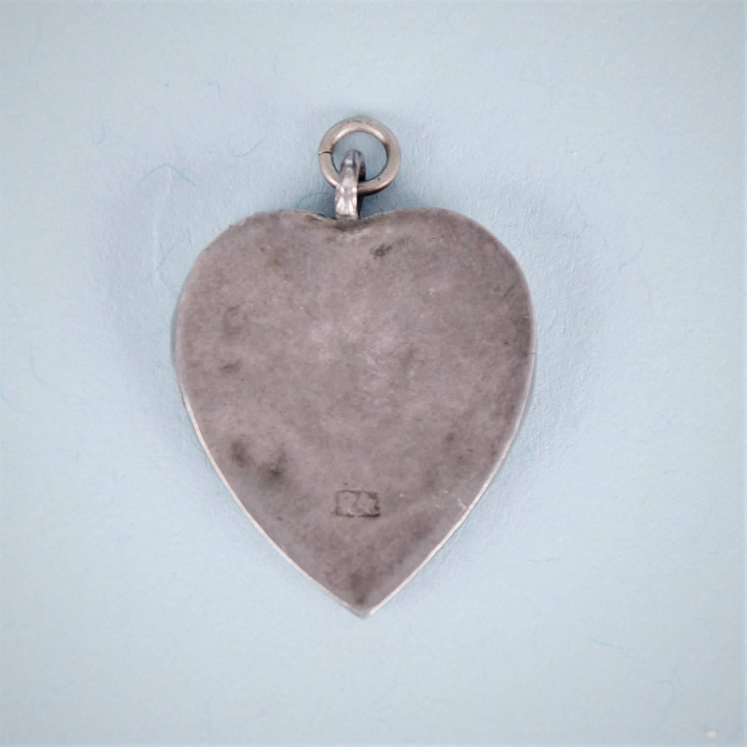 Charming Charles II silver heart shaped locket, celebrating the marriage of Charles II & Catherine of Braganza. 
Maker's mark beginning with the letter 'R' is struck on the reverse, London, circa 1662. 

Width: approx. 0.87 inches (2.2cm).