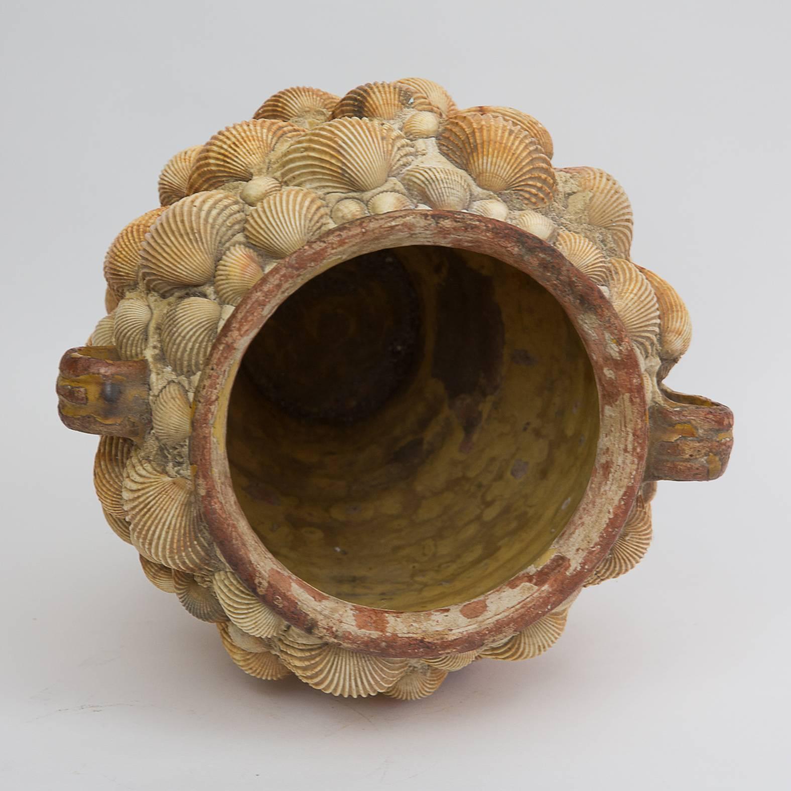 An handcrafted 19th century confit pot covered with sea shells, France, 1920.
In perfect condition.
