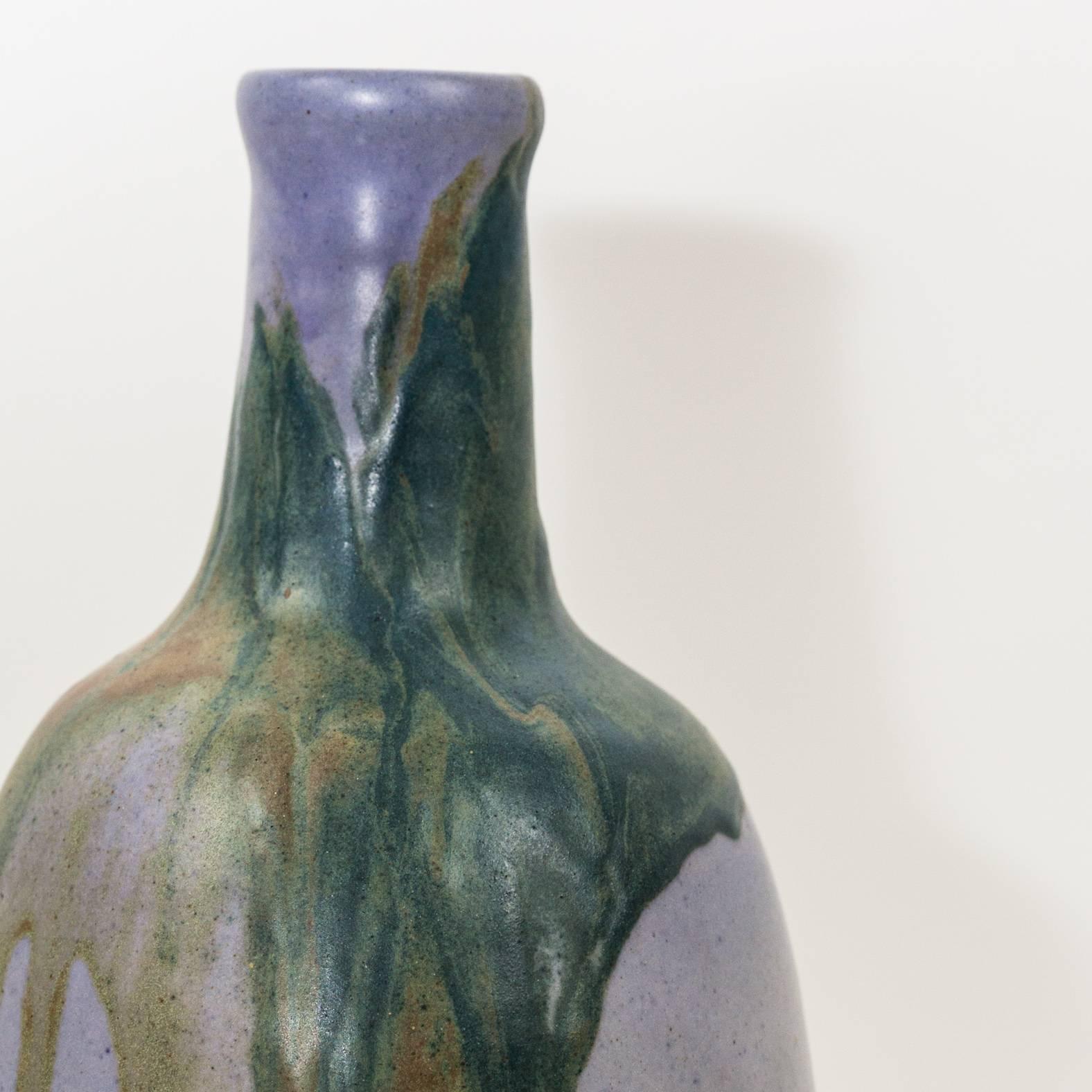 A lavender glazed dripping vase by Leon Pointu-major figure of the Art Nouveau Ecole de Carries in France, circa 1900. Signed.
