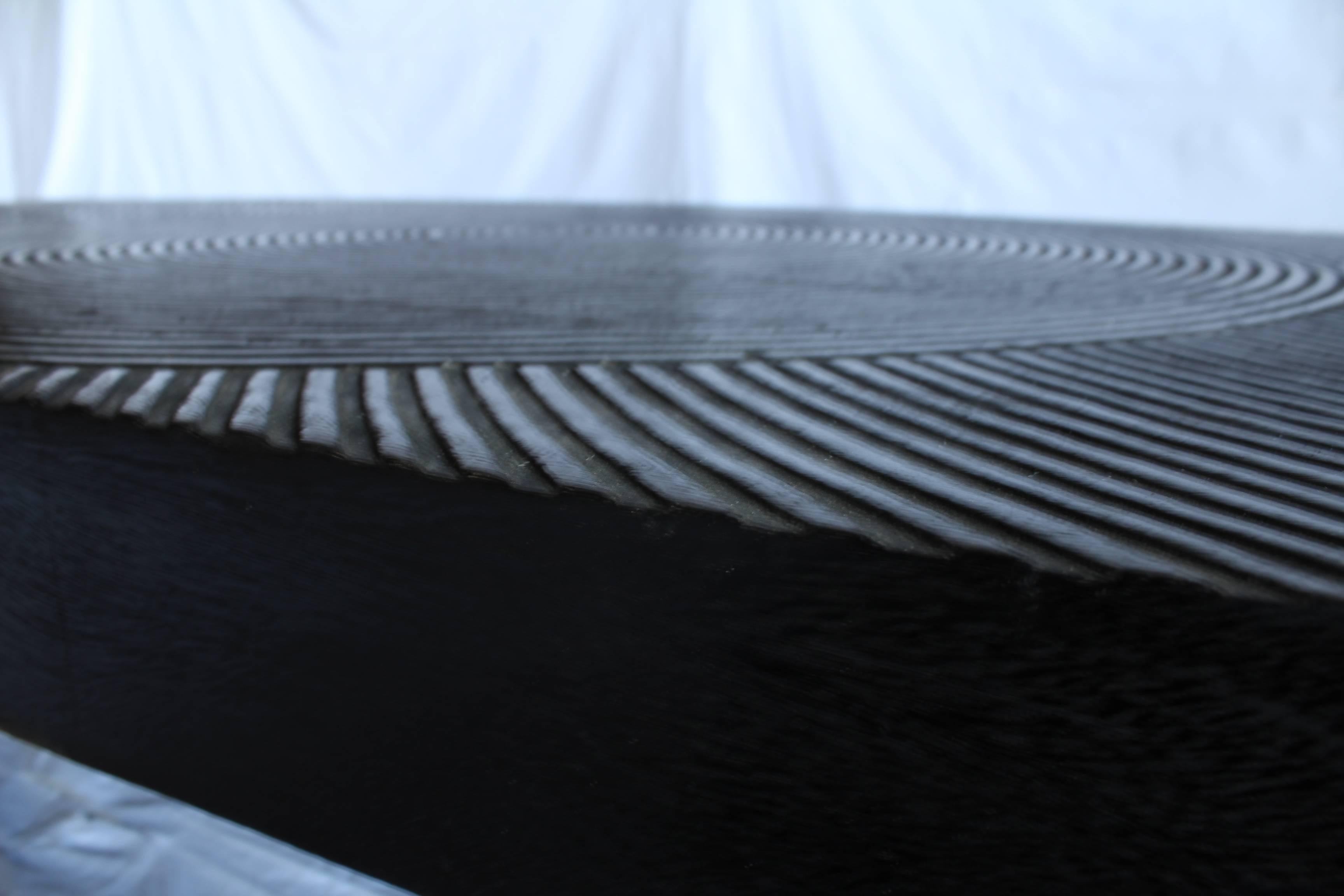 20th century African blackwood coffee table with very unusual design on top.