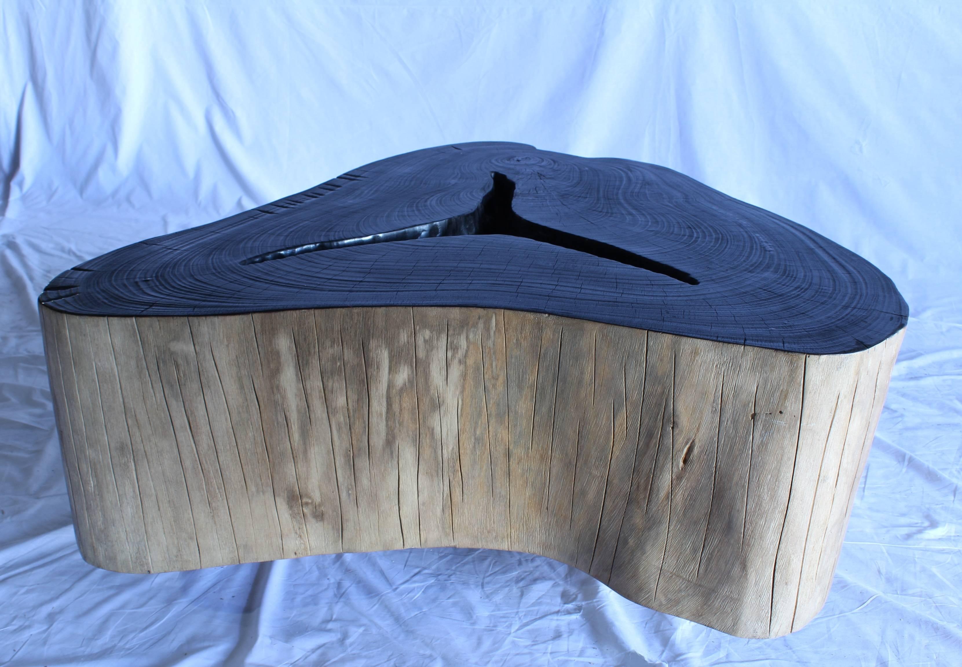 Solid bahar wood coffee table with black lacquered top.