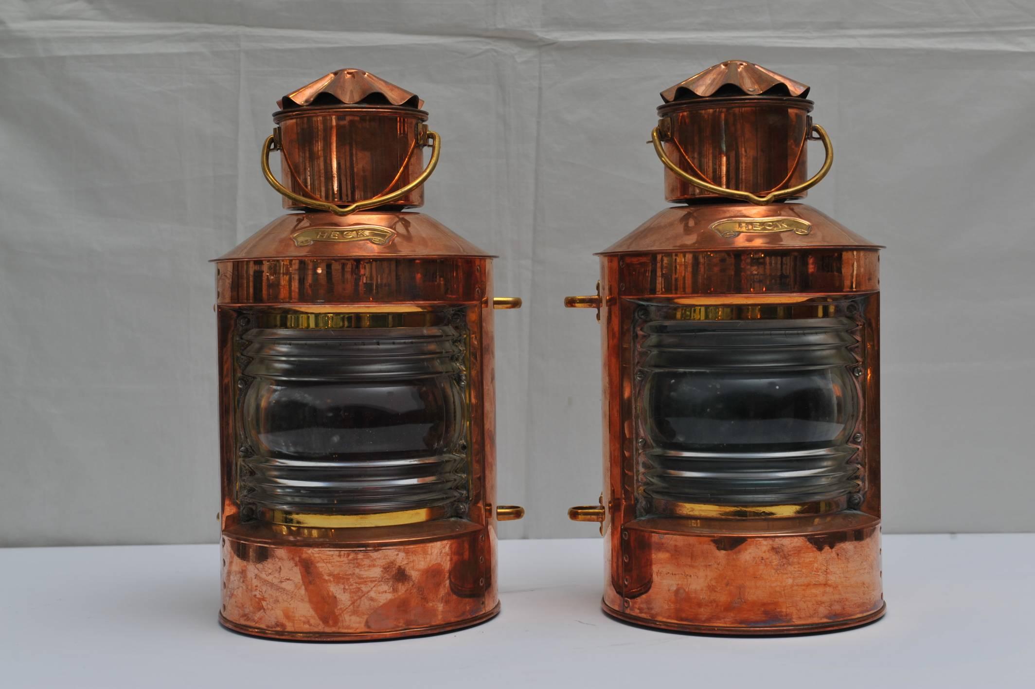 Pair of port and starboard navigational lights in a copper housing. Brass Heck nameplate on front, Fresnel lens which are indeed red and green with brass side mountings. Interior kerosene lights. Mid 1900s, fully restored.

Navigational and