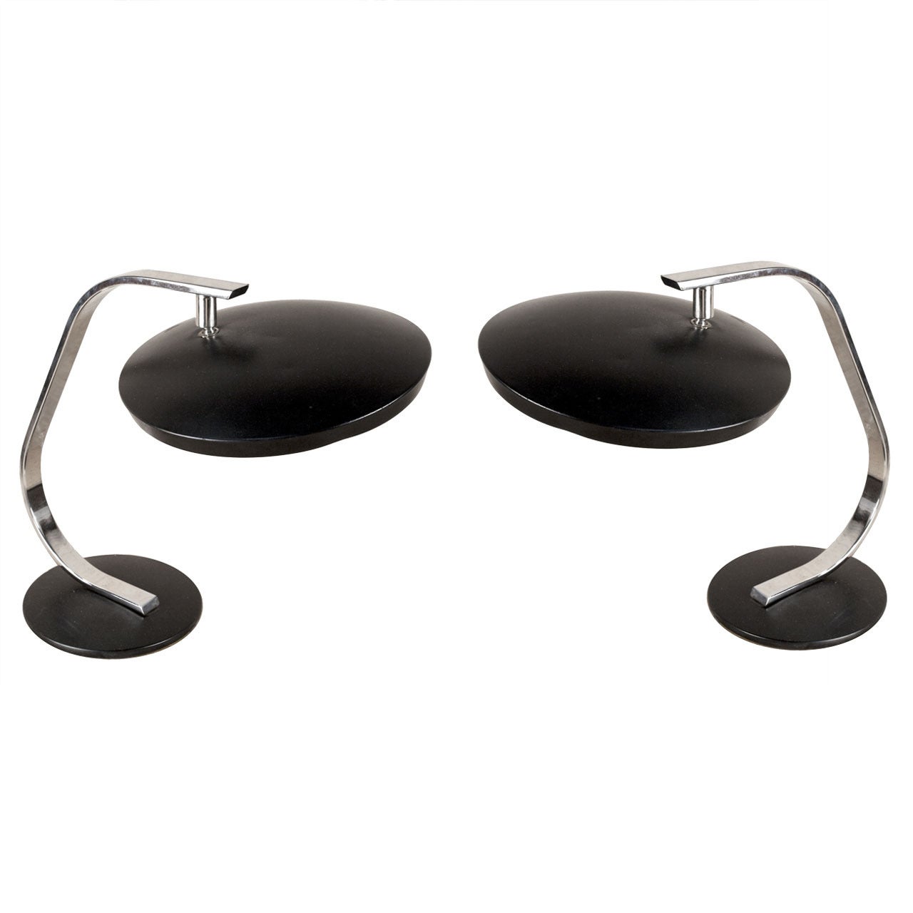Pair of Fase (from Madrid), Mid-Century Modern chrome and enameled black metal desk lamps from a ship's stateroom. The shade is adjustable to tilt to any preferred angle. Just the shade has a 12 inch diameter and the base has an 8 inch diameter.