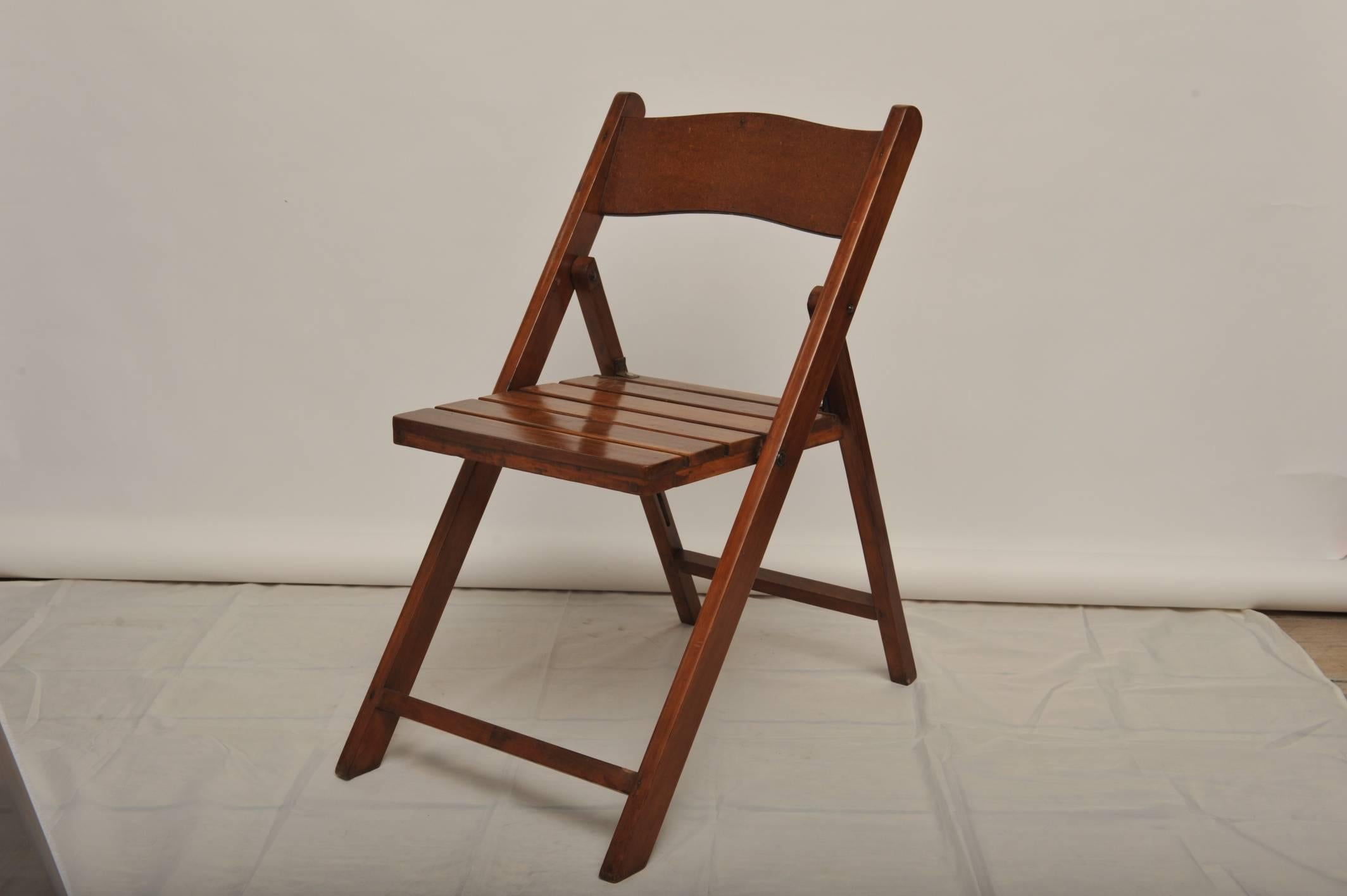 This is a set of eight folding teak chairs from a Mid-Century merchant ship's galley. They fold up quite flat when not in use making for easy storage. Included is a set of custom-made, linen, tie-back seat cushions.

Nautical artifacts on