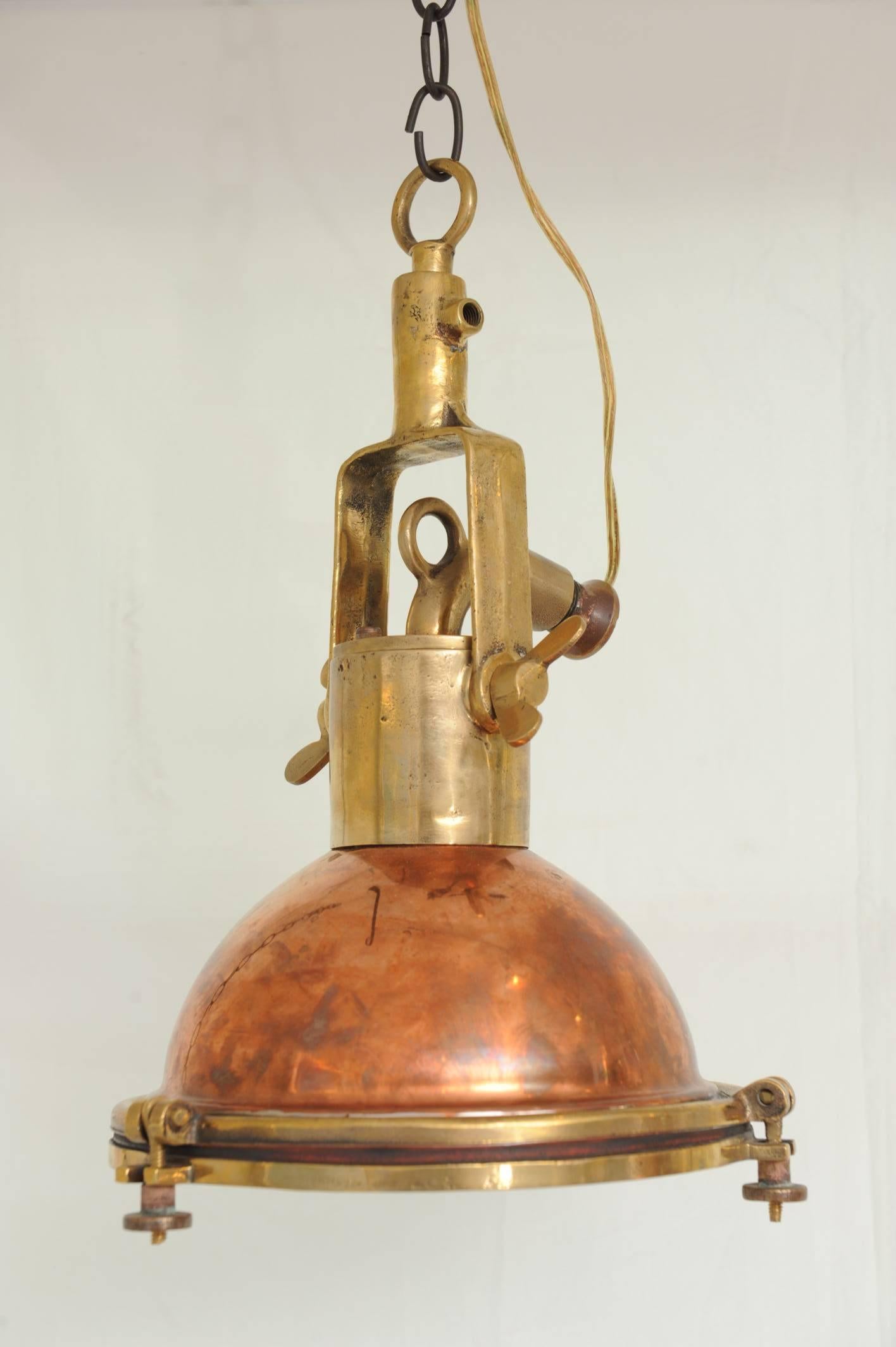 Pair of original Mid-Century ship deck light, copper and brass. Rewired for American use and takes a regular size light bulb. Silver lined interior to reflect additional light.