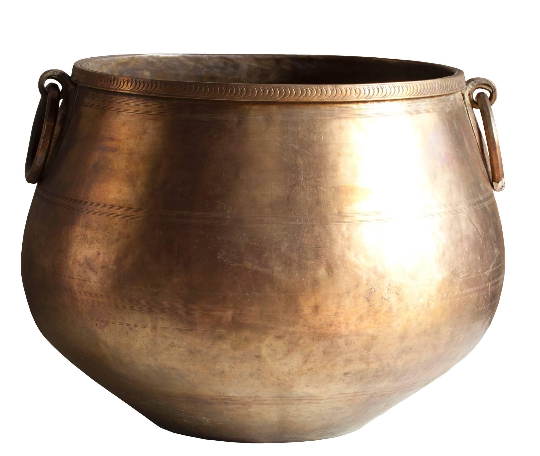 Elegant bronze planter with brass, hand-tooled detailing along the rim and under the handles. Early 1900s Southeast Asia. Great size. The belly measures 19