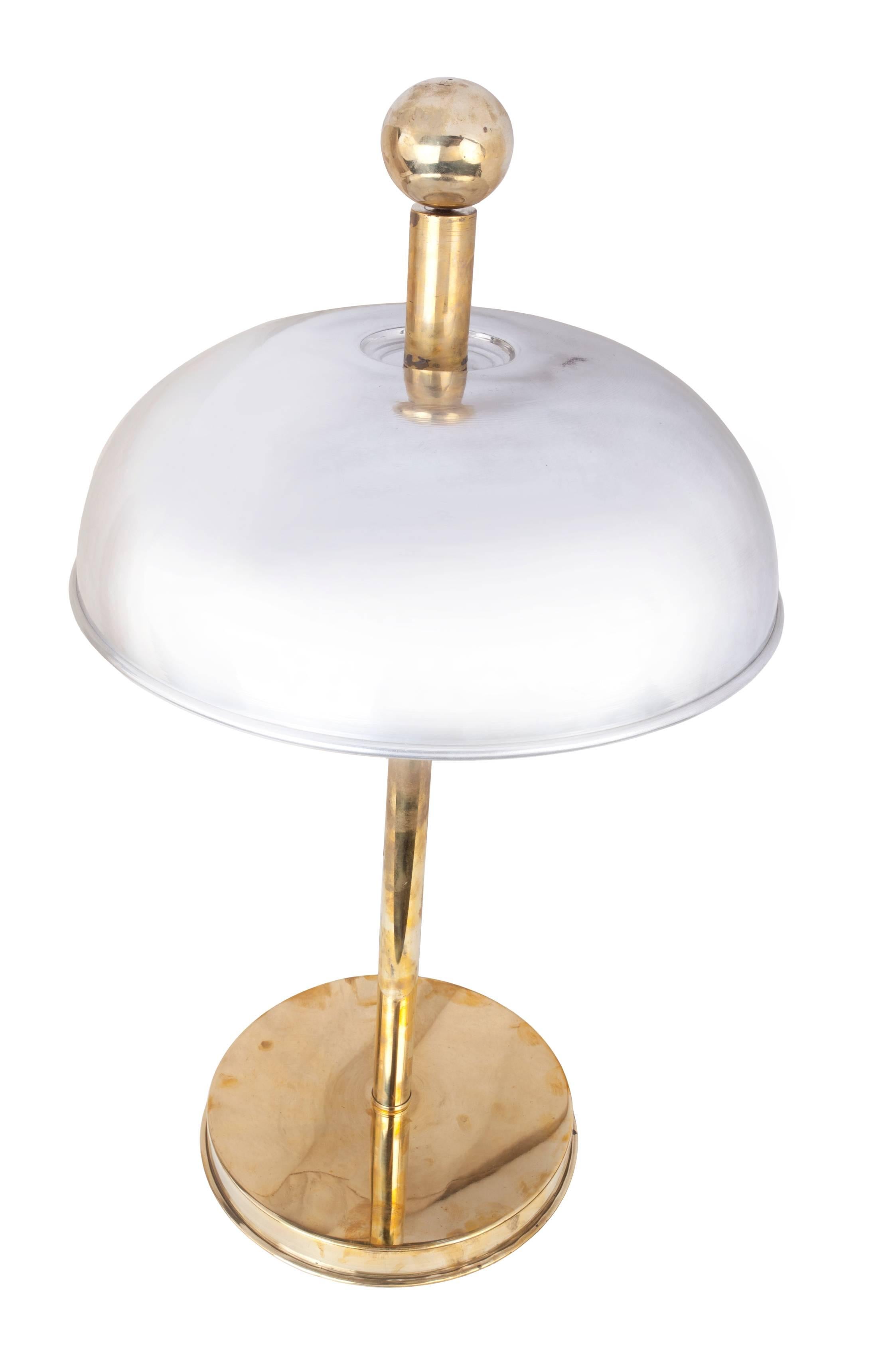 Fabulous pair of Mid-Century brass and chrome table lamps from a ship's stateroom. Takes two regular size light bulbs per lamp. Rewired for American use and polished. Base diameter is 10 inches, distance to the bottom of shade from the table is 16