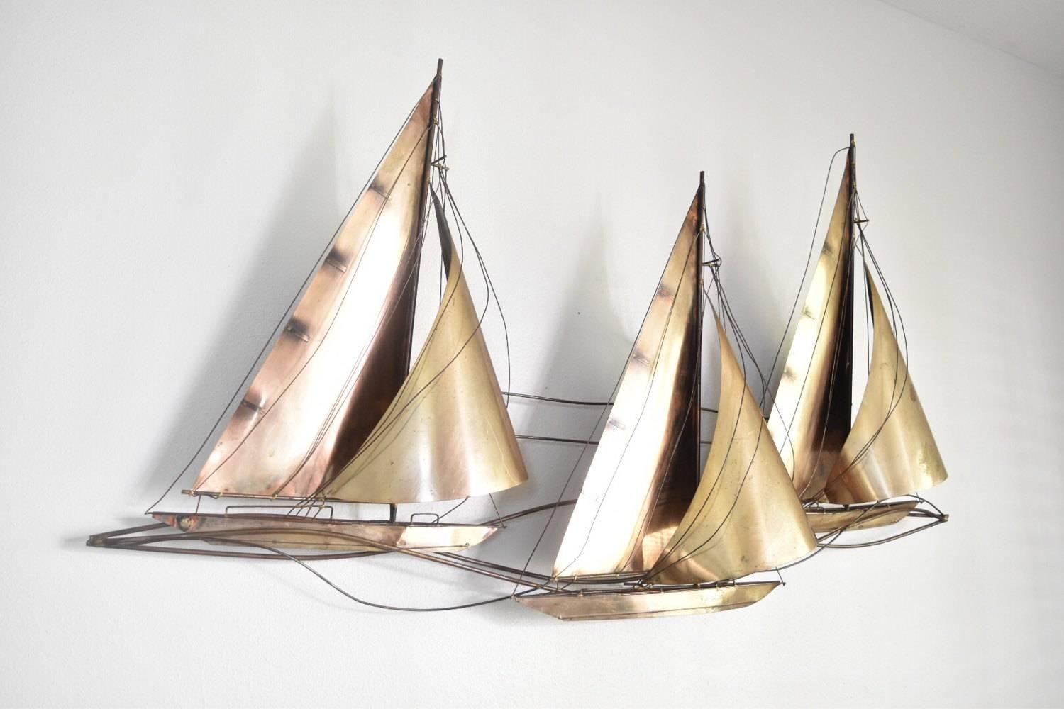 A signed and dated Curtis Jere (Curtis Freiler and Jerry Fells) sailboat wall sculpture of the Brutalist period in fantastic condition. Original patina and signed 1977. Rare find of the three brass racing sailboats. It has mounting brackets on the