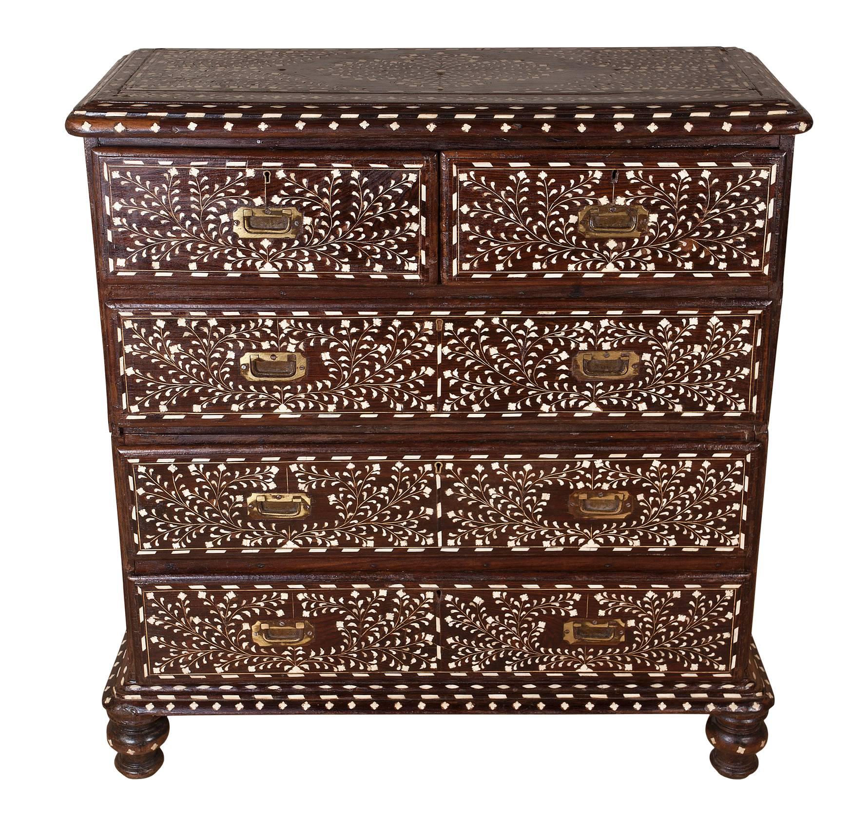 British Campaign with a twist! This is an exceptional late 19th century Campaign rosewood chest of drawers .....two parts, flush brass drawer pulls....but with highly intricate bone inlay. The inlay design is done in very small and shaped pieces in