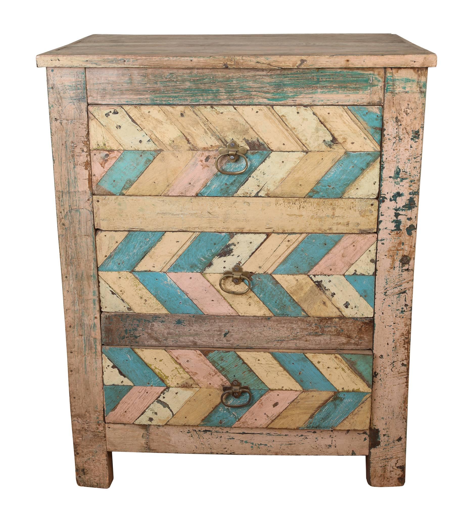 Not twins, more like sisters or cousins, a pair of reclaimed wood side table cabinets one with door front and interior shelf and the other with three drawers. Late 1800 architectural fragments, modernly re-repurposed. Brass hardware.