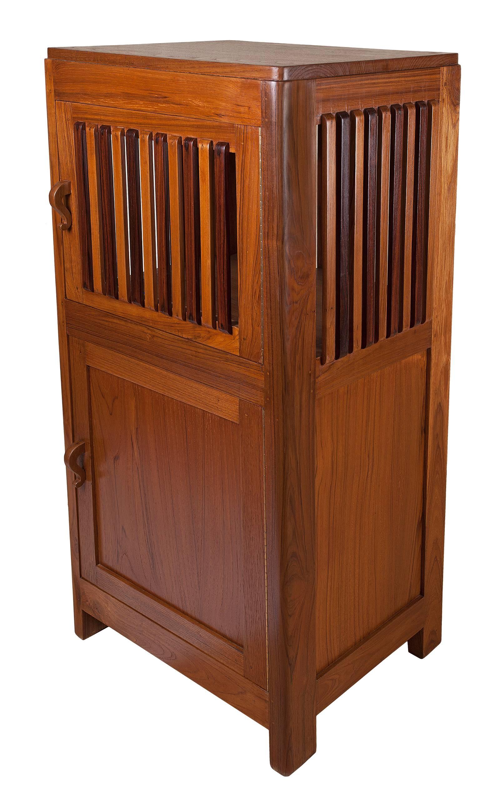 Unusual, Mid-Century teak and rosewood pie safe. Mid-Century, Colonial British. Two compartments, upper and lower....and the upper portion has alternating teak and rosewood slats all around.