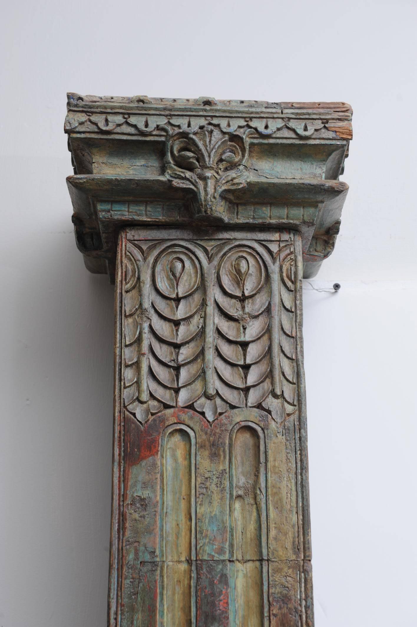 Fabulous pair of square, solid teak, reeded columns with original paint on carved stone bases, also with original paint. Capitals are a separate piece mortised at the top. Originally weight-bearing, but can be used to accent a room.....although I