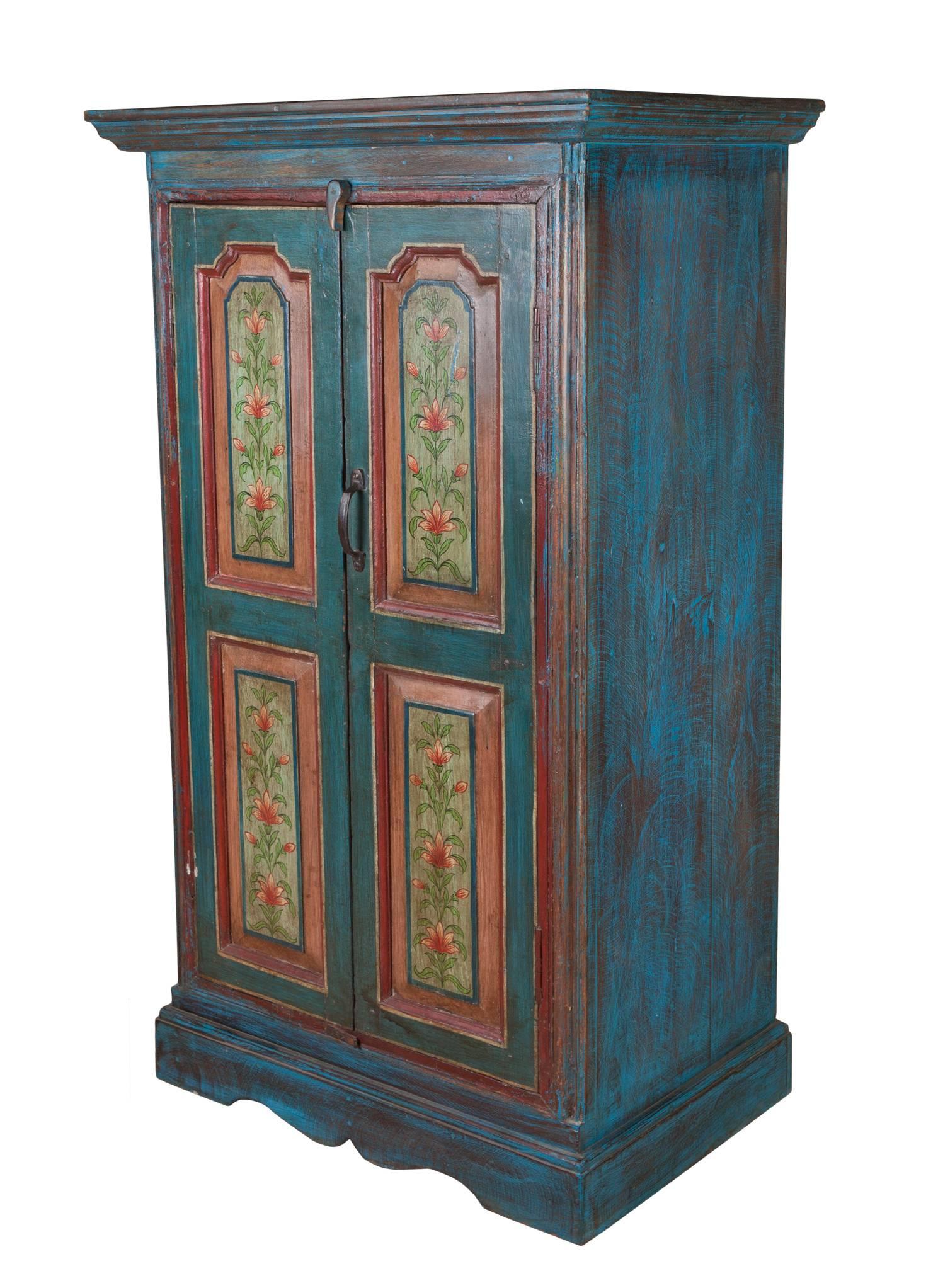 Beautiful, hand-painted window shutters from the early 1900s, converted to a cabinet using reclaimed wood from architectural sites. The wood is teak and the paint away from the original shutters has been made to match them. The body without the