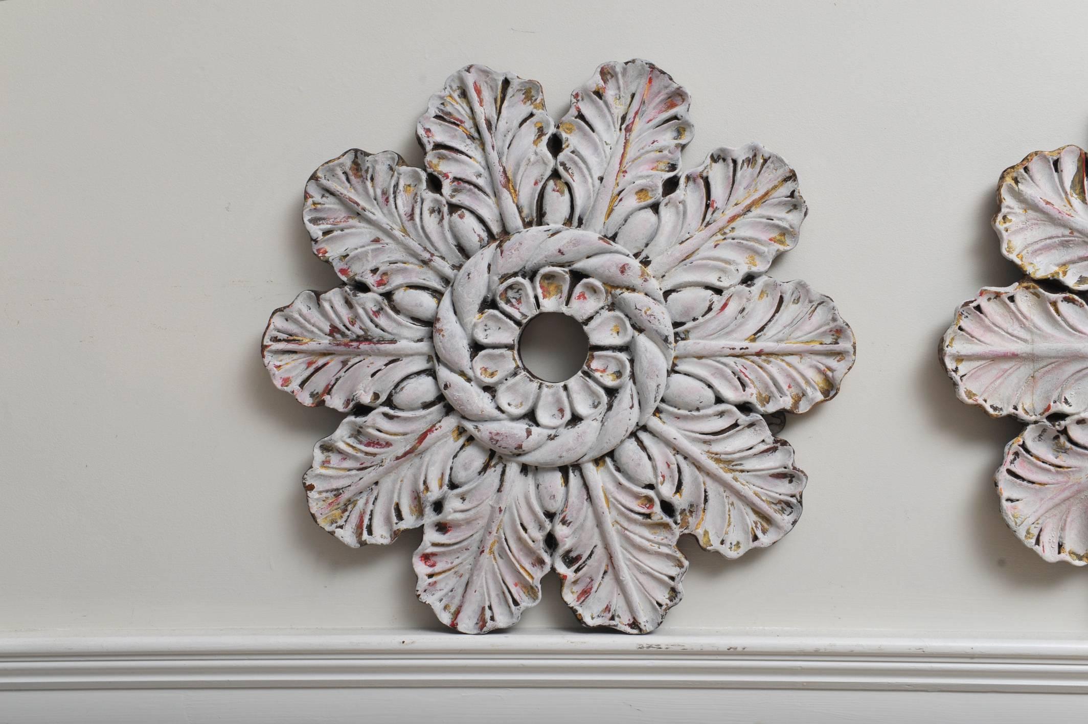 Set of three large and amazing carved wooden ceiling medallions in a flower design with original paint. Great on a wall as well. If you look closely, two are closer to a pair than the third but then that's the nature of a handcrafted piece. Nothing