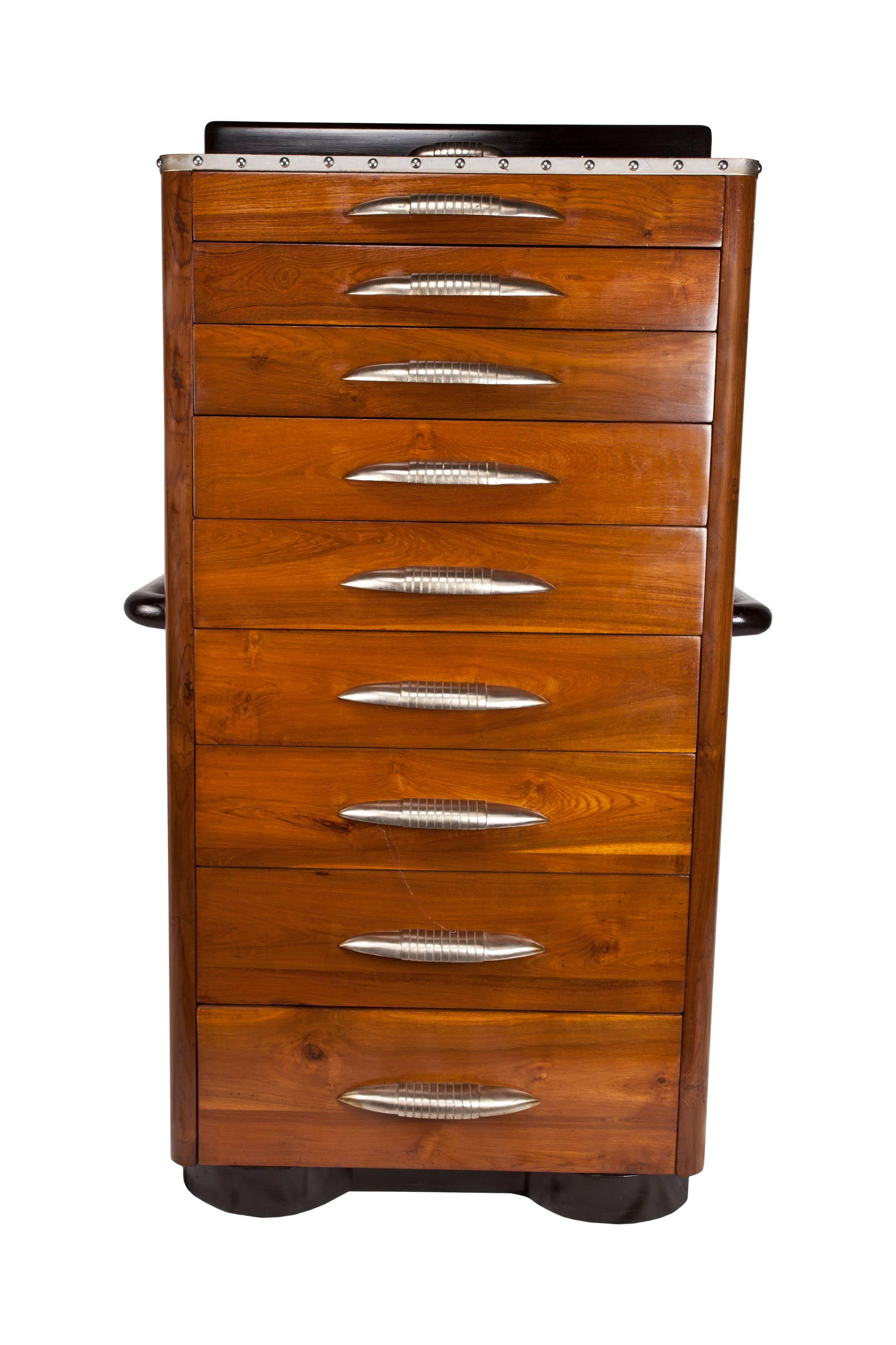 Rare Art Deco period mahogany gentleman's chest with rosewood and chrome accents. Features a series of nine graduated drawers with original chrome drawer pulls, rosewood handles, crest and base. The rosewood crest portion lifts up to store smaller