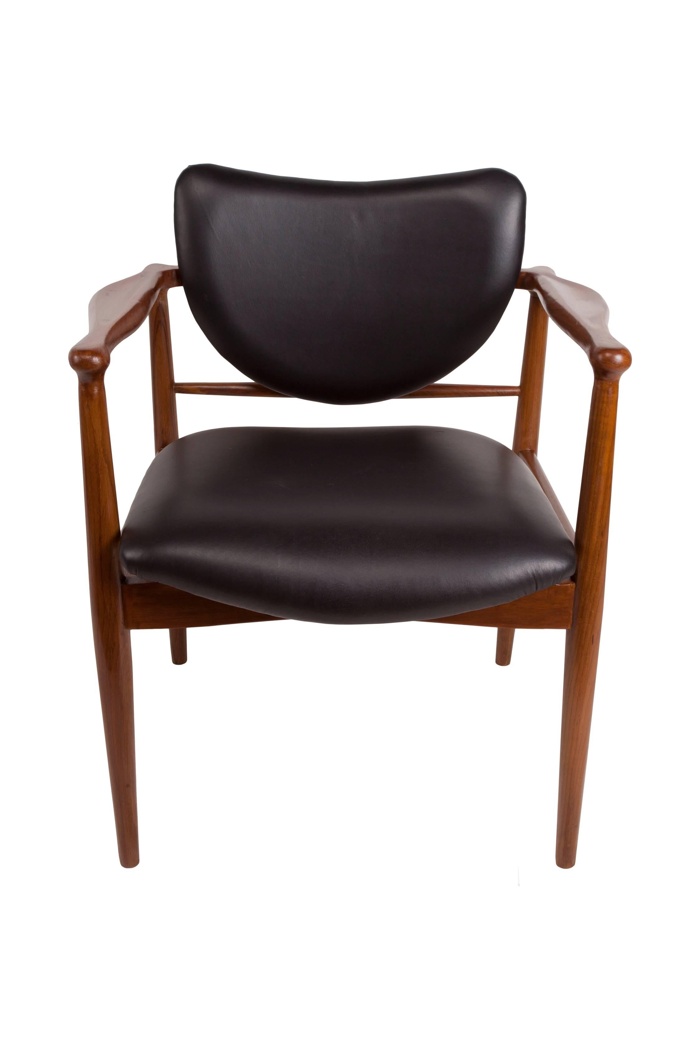 Fabulous Danish Mid-Century Modern teak and black leather chair attributed to Finn Juhl for Baker. Great design and style, refinished and very comfortable. Leather upholstery redone. Great style, great lines.  Makes a great desk chair too.

 
