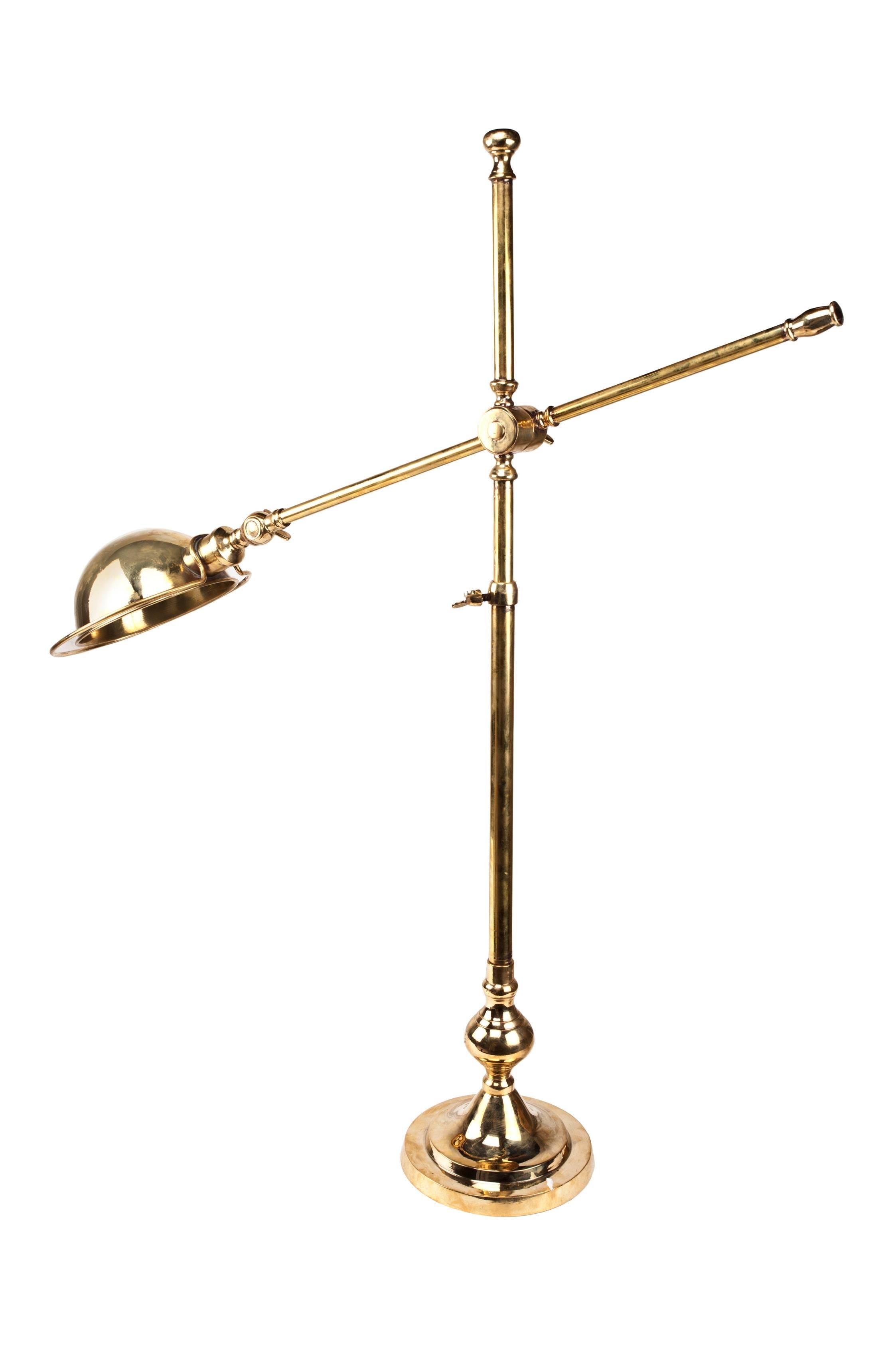 Adjustable brass ship's desk light from a stateroom. It is adjustable in three ways, the height, the angle of the arm and the angle of the shade. As of this writing I have 2 of these. They take a standard base bulb and rewired for American use. The