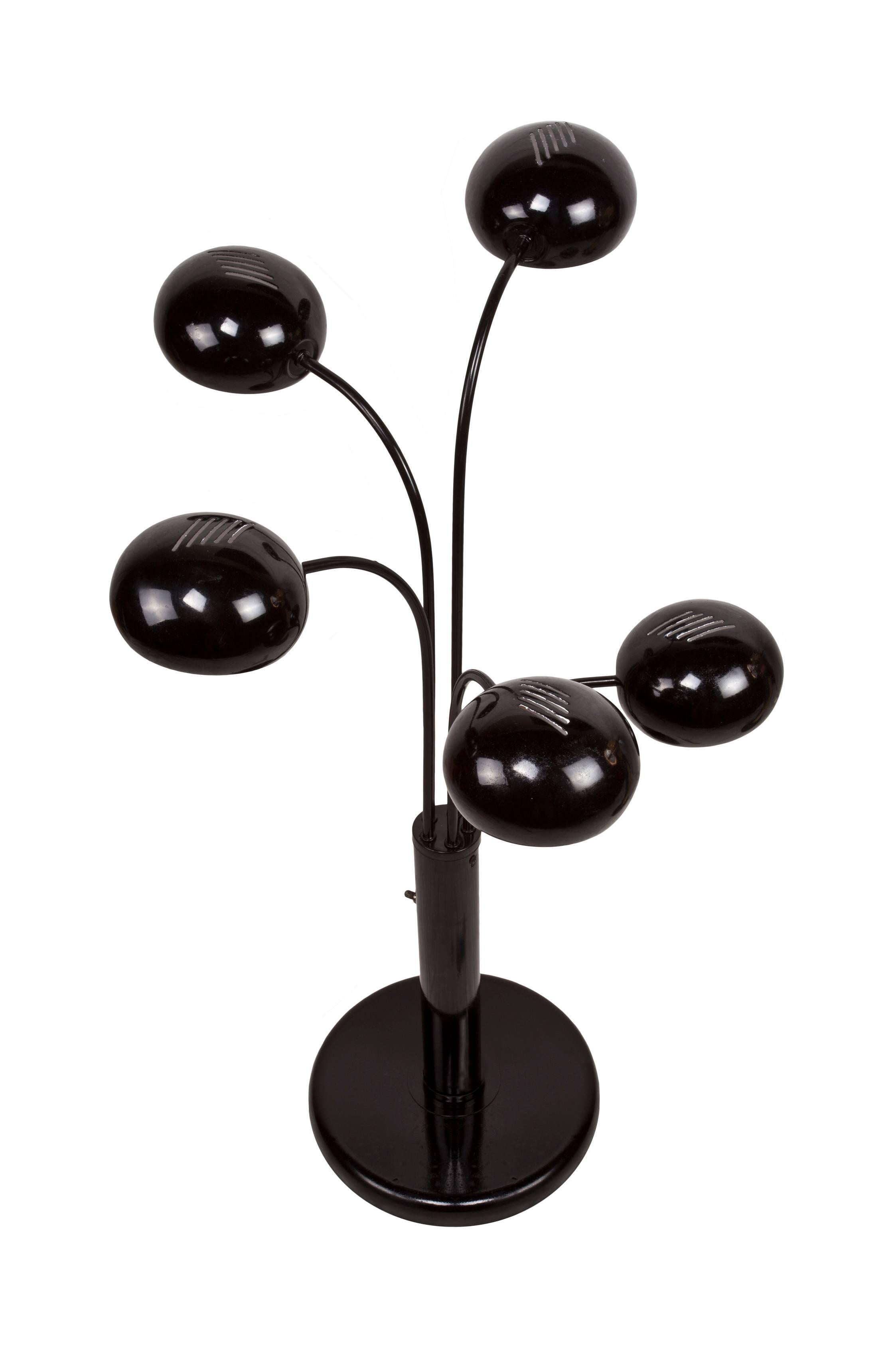 This was a great find, along with a sister piece which is a table lamp (available as of this writing). Metal floor lamp with black enamel paint with five arms which adjust side to side. The inside of each vented shade is white enamel and takes an