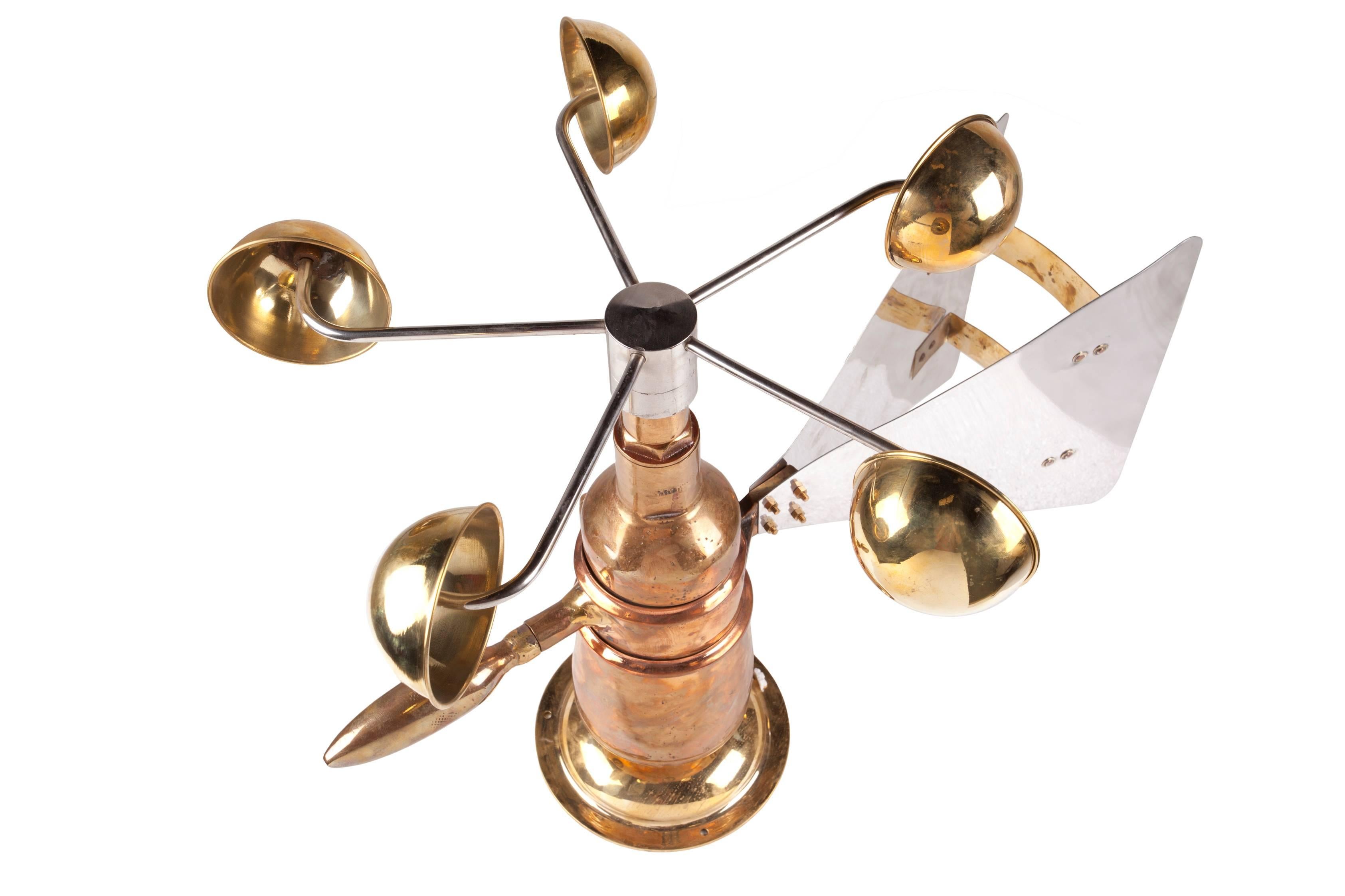 Midcentury Ship's Anemometer in brass with an aluminum fin. These were used outside on ships to measure wind speed and direction connected to a corresponding gauge on the bridge. This has great sculptural form and a rare find. The brass base has
