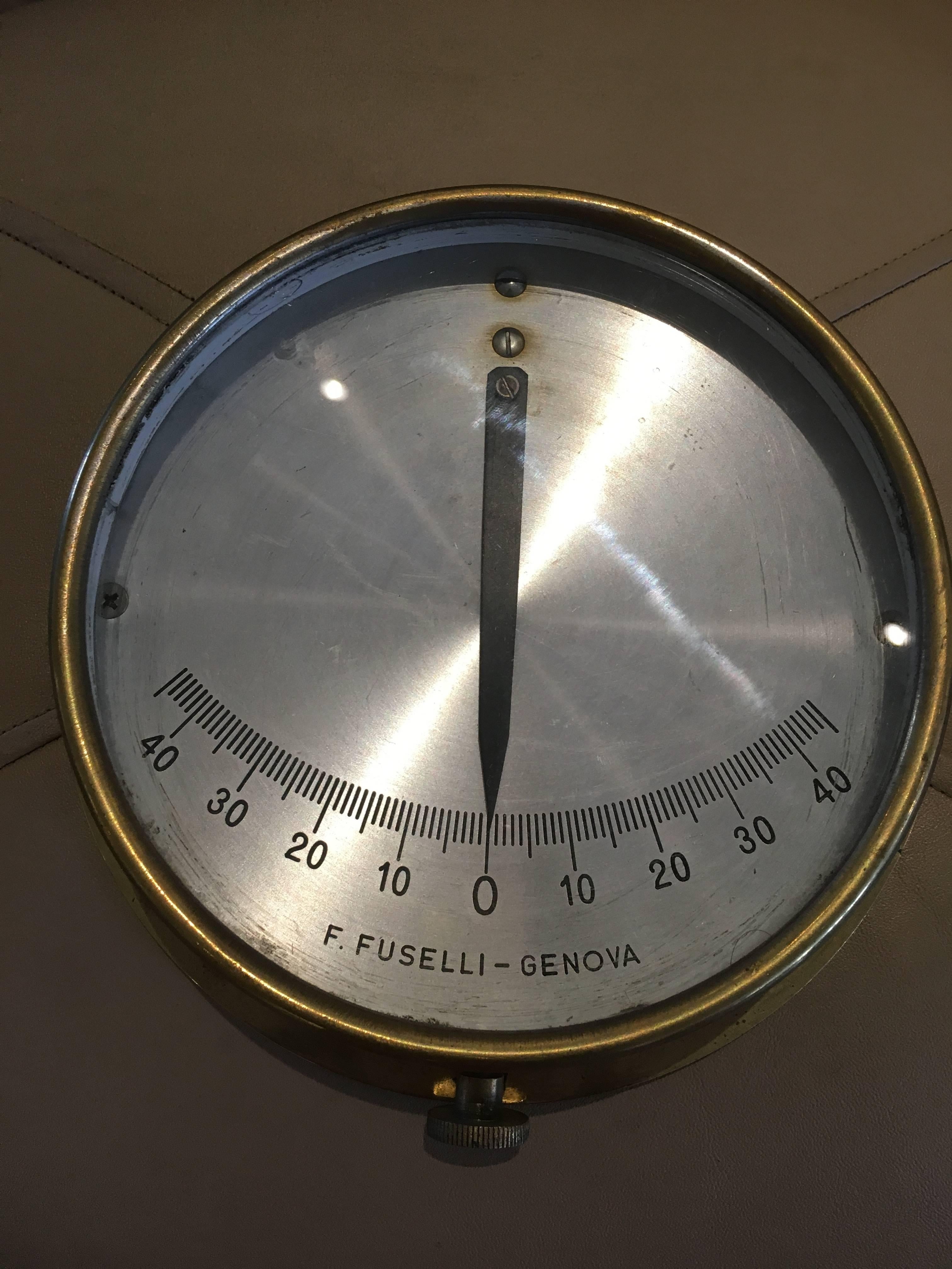 Midcentury Italian ship's brass clinometer. These tilt gauges were used on vessels to measure the angular slant of the ship at sea. The readings are important whether underway, but also for loading cargo evenly. Old school technology that always