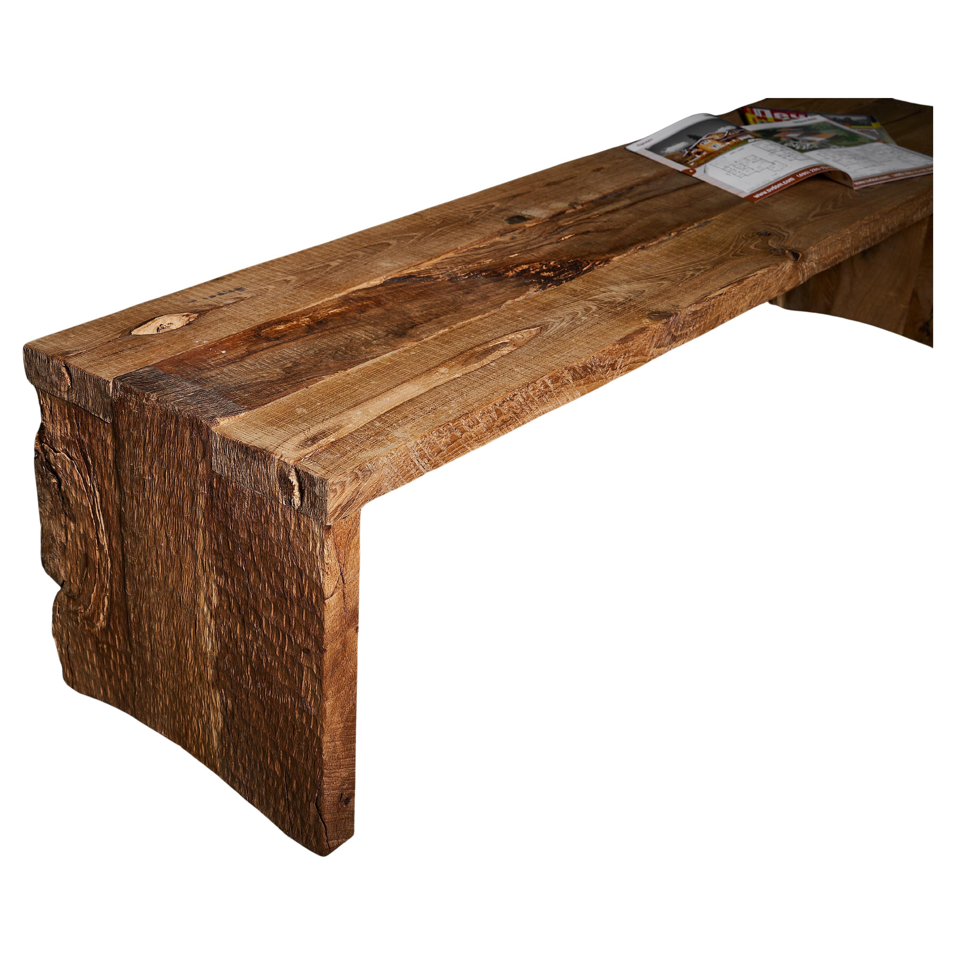 Designed as a brutalist statement piece, this handcrafted solid oak bench stands out with its raw volume and architectural cuts. Made by Moldovan designer Sergio Vulpe, it works as a monolithic TV console or sculptural accent.

This sculptural bench