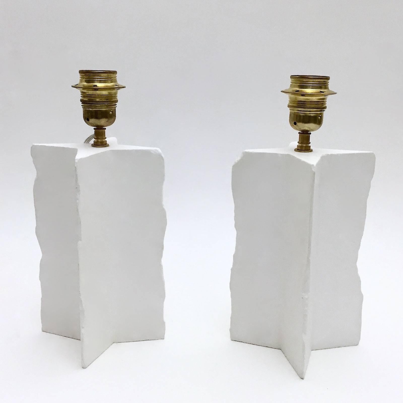 Pair of elegant matte and polished white plaster cross lamp-bases, with handcrafted uneven edges. 
A second version is also available with straight (even) angles displayed on our storefront. 

Height dimensions approximately are without the