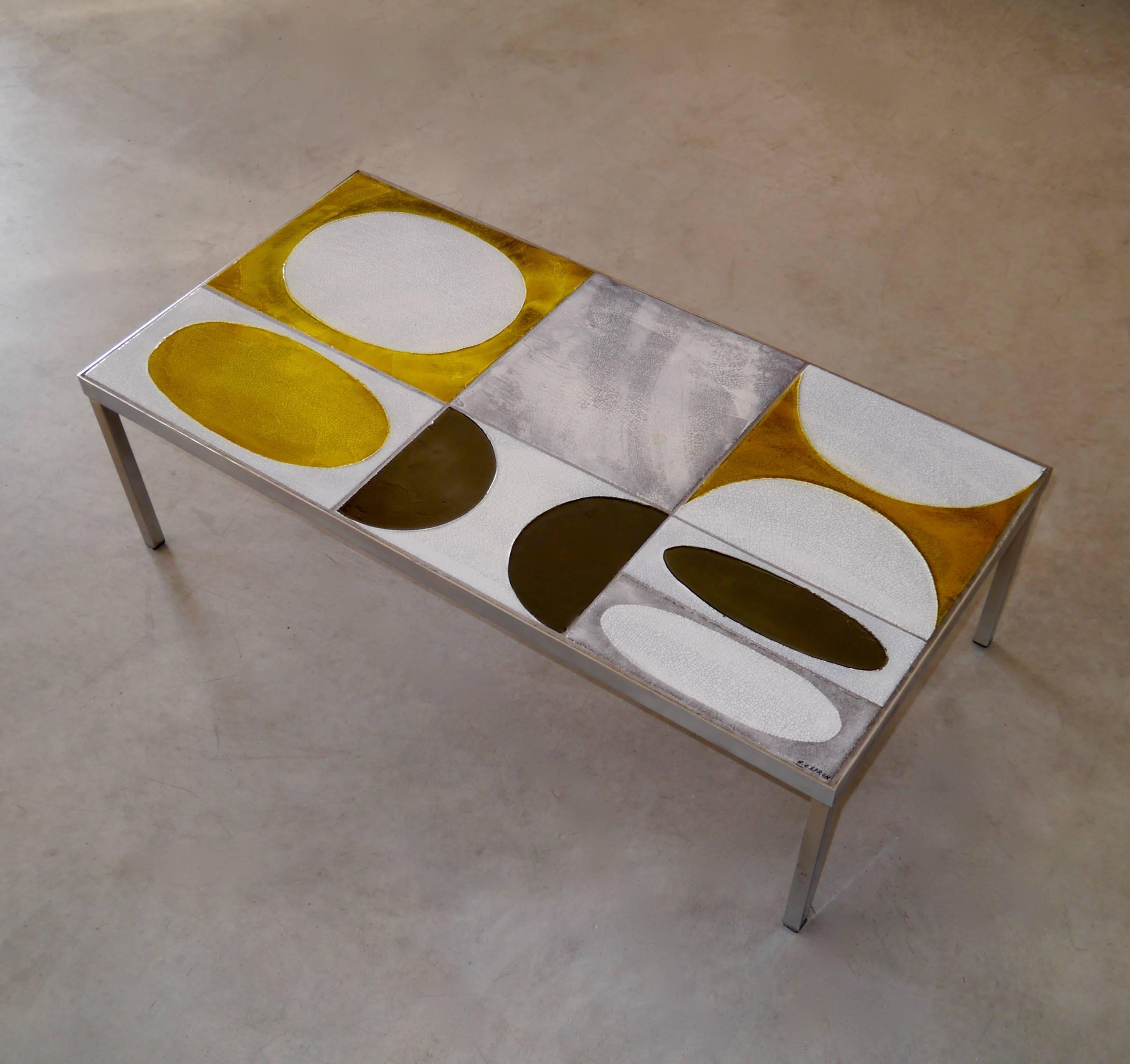 Glazed lava table top with geometric and textured patterns.

Metal frame and feet.

The table is signed by the French artist.

With the exception of a light default at one angle, this table comes in its original and exceptional