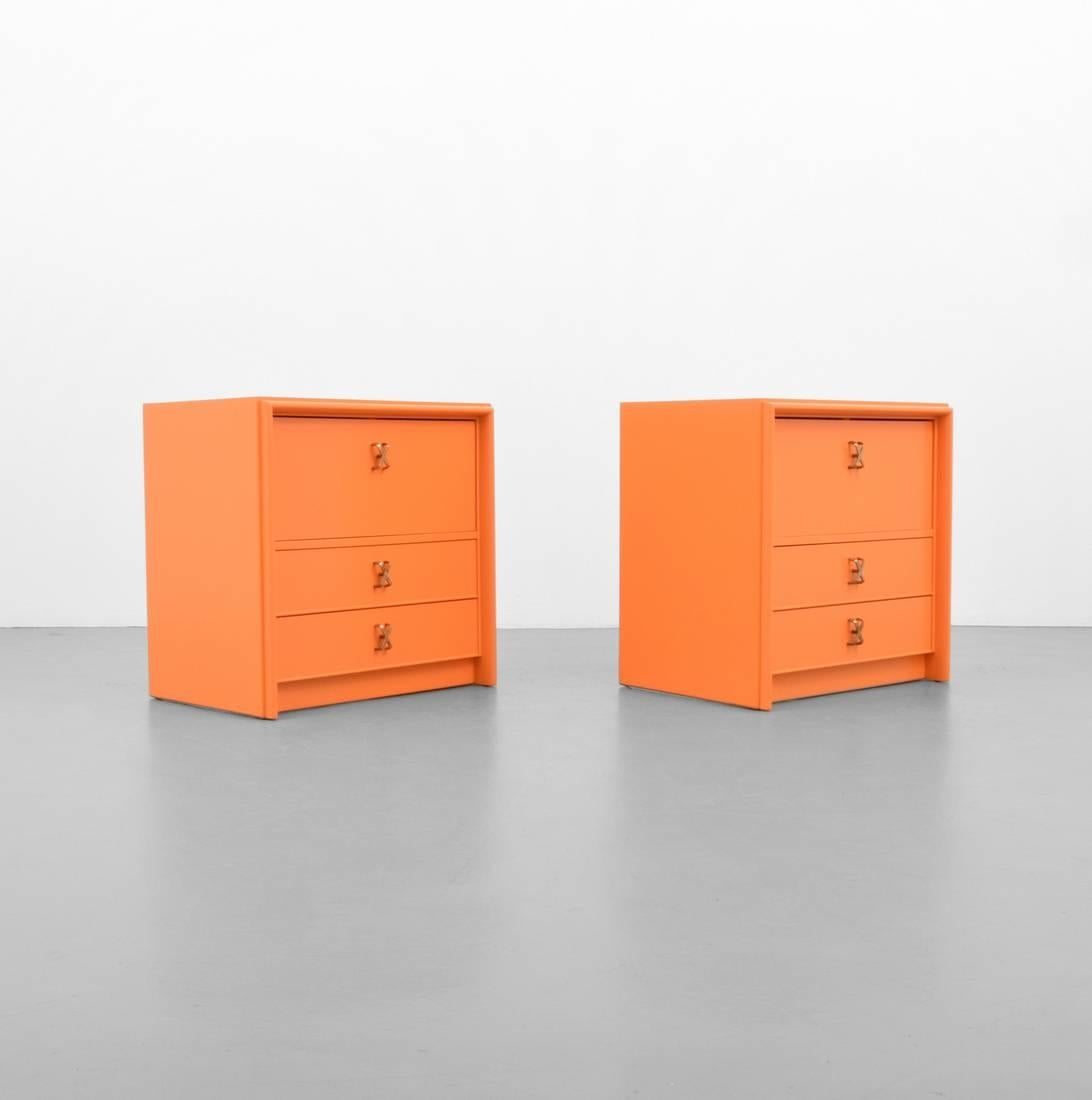 Gorgeous pair of orange lacquer nightstands by Frankl.