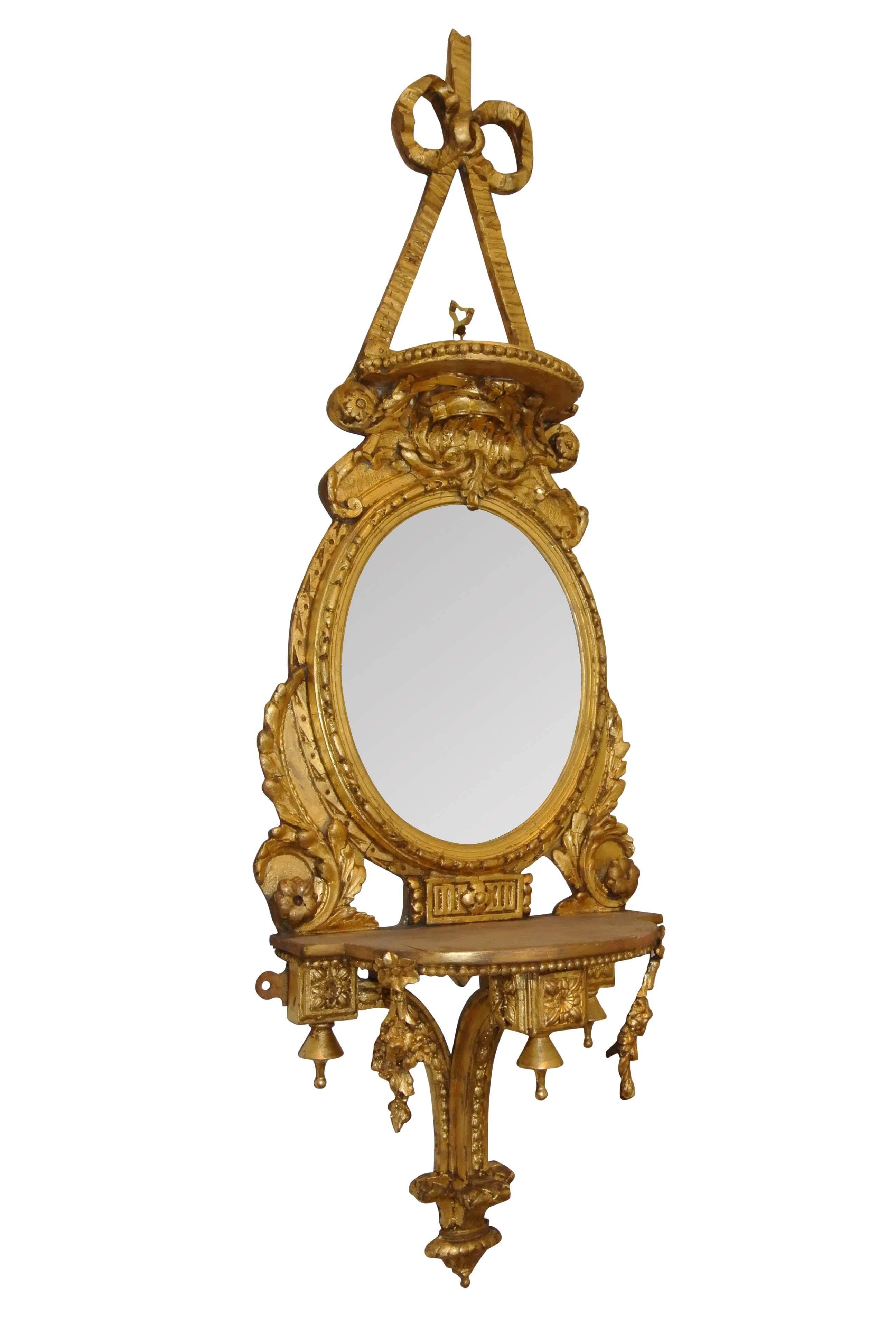 Pair of mid-19th century decorative gilt mirror sconces with original mirror plates, in very good condition.