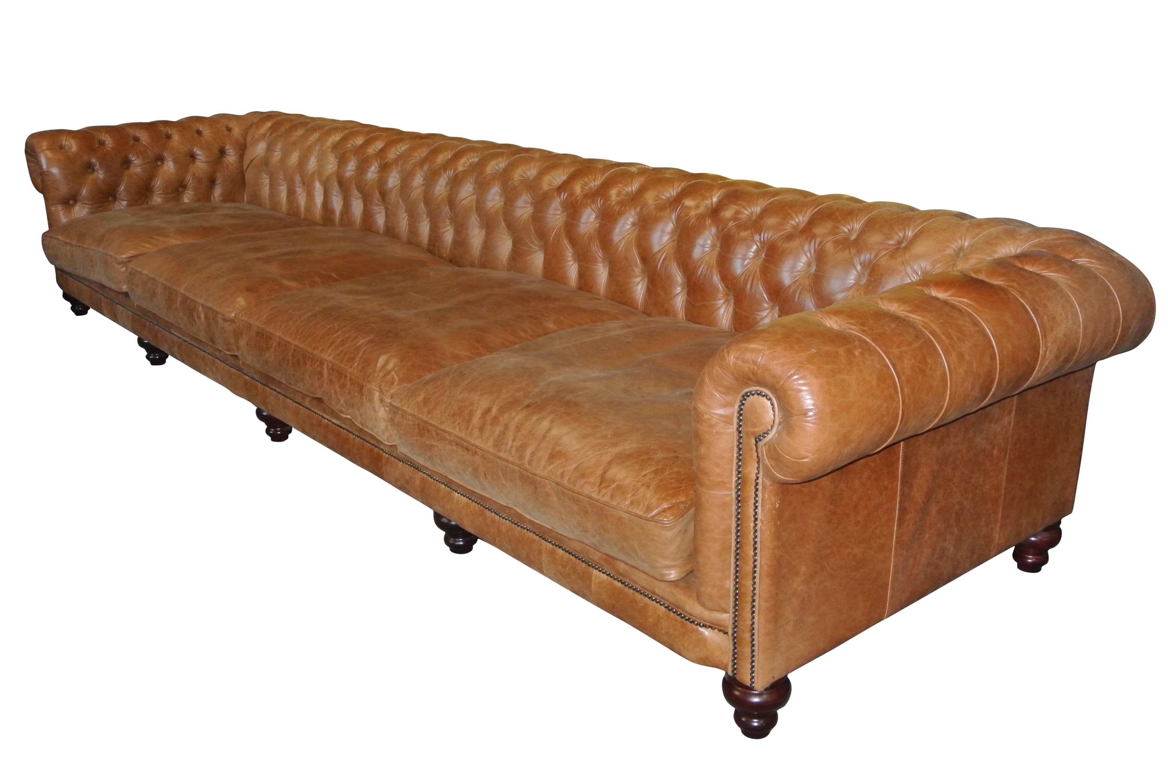 Very large handmade Chesterfield settee in chestnut brown leather.