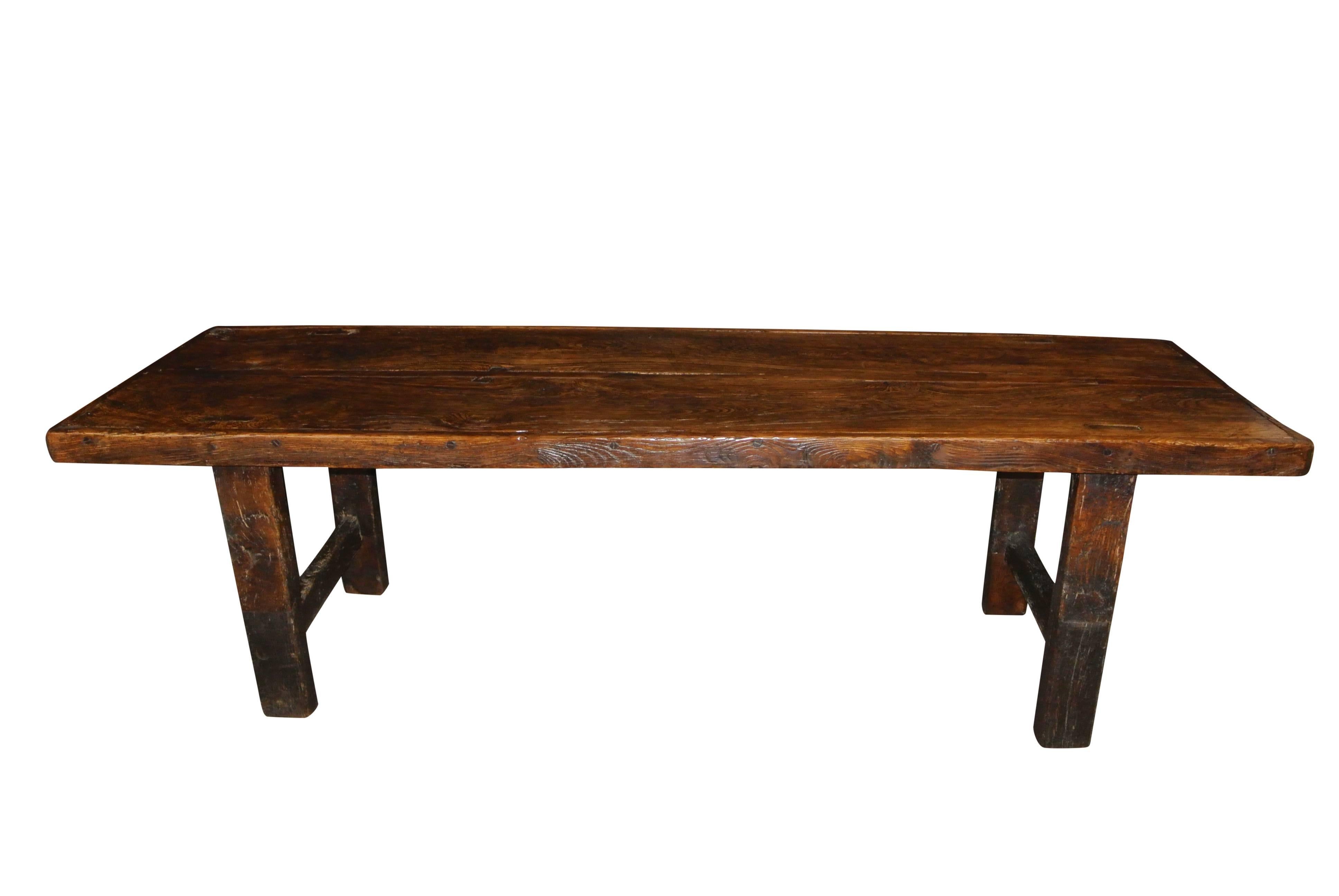 FINAL REDUCTION! A large rustic early 19th century French elm farmhouse table of excellent colour and figuring.