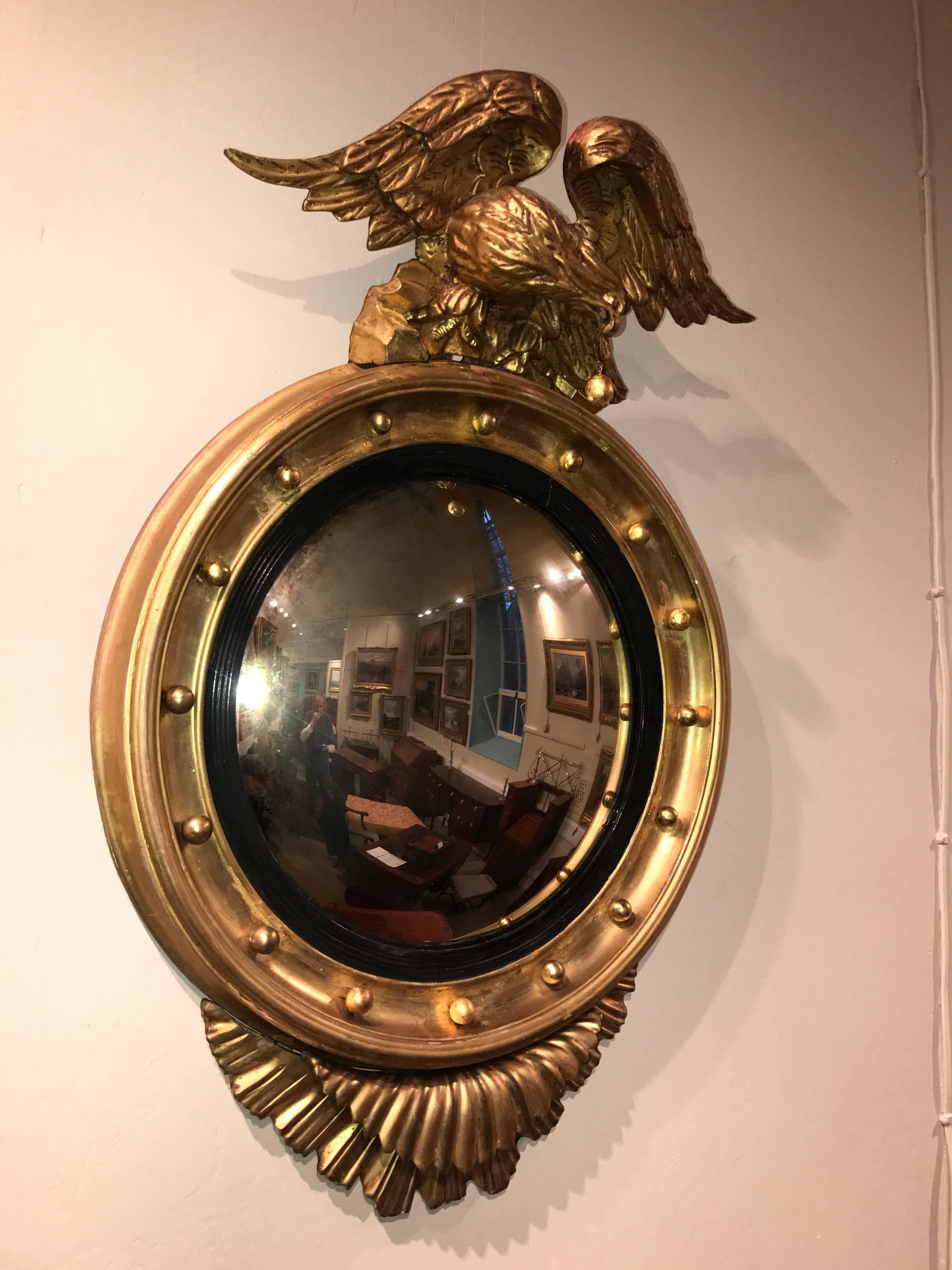 Giltwood 19th Century Eagle Crested Convex Gilt Mirror