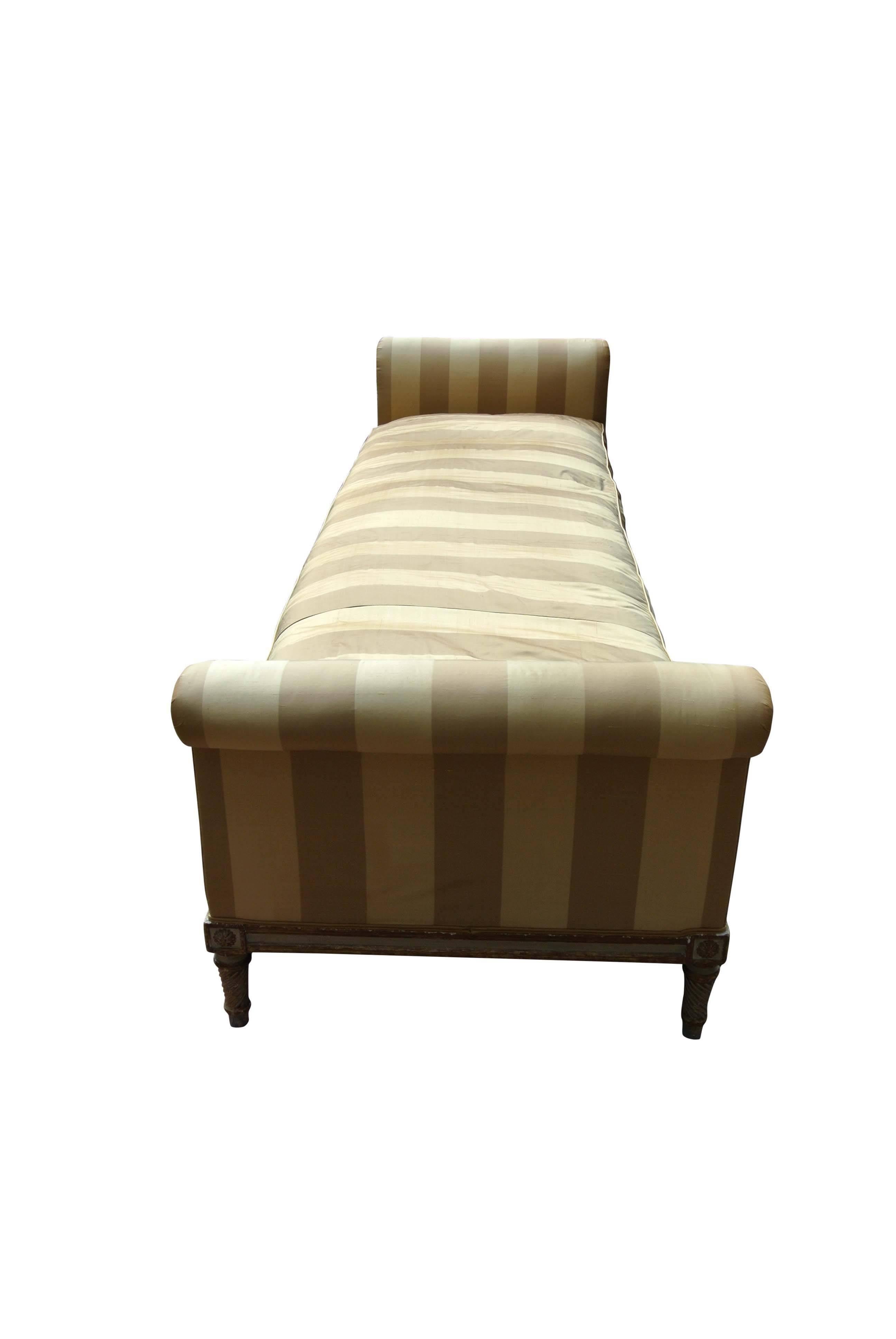 A fine quality pale grey and gilt lit du jour with scrolled ends and original decoration. The upholstery is pure new silk.