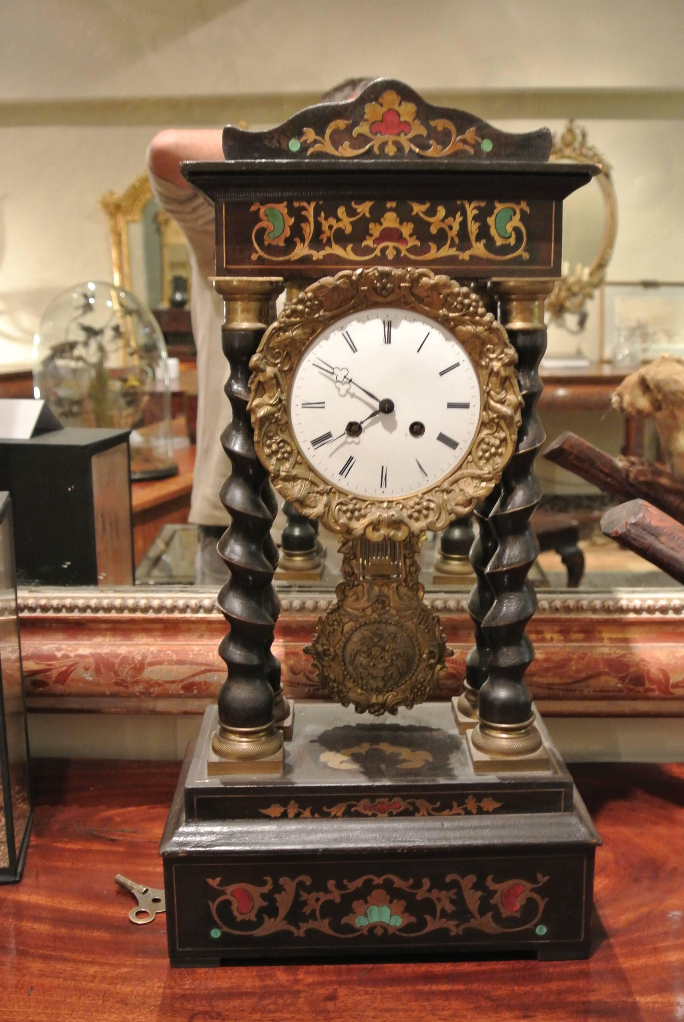 French Empire style brass inlaid portico clock, circa 1880. Recently restored.