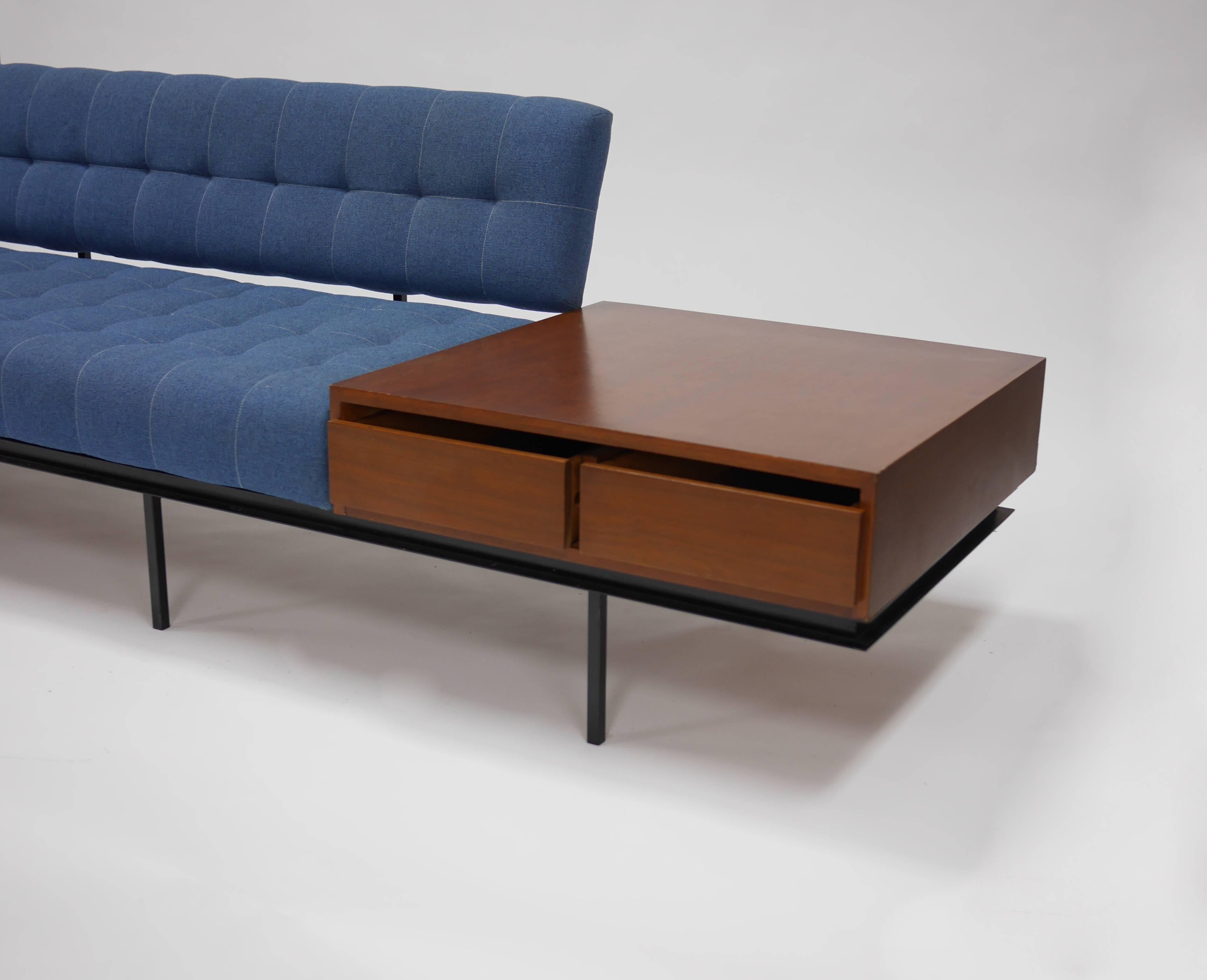 Sofa and cabinet by Florence Knoll.

Rare enameled steel sofa and two-drawer walnut end cabinet, circa 1960s.
Signed with Knoll Associates label.
Measures: 30
