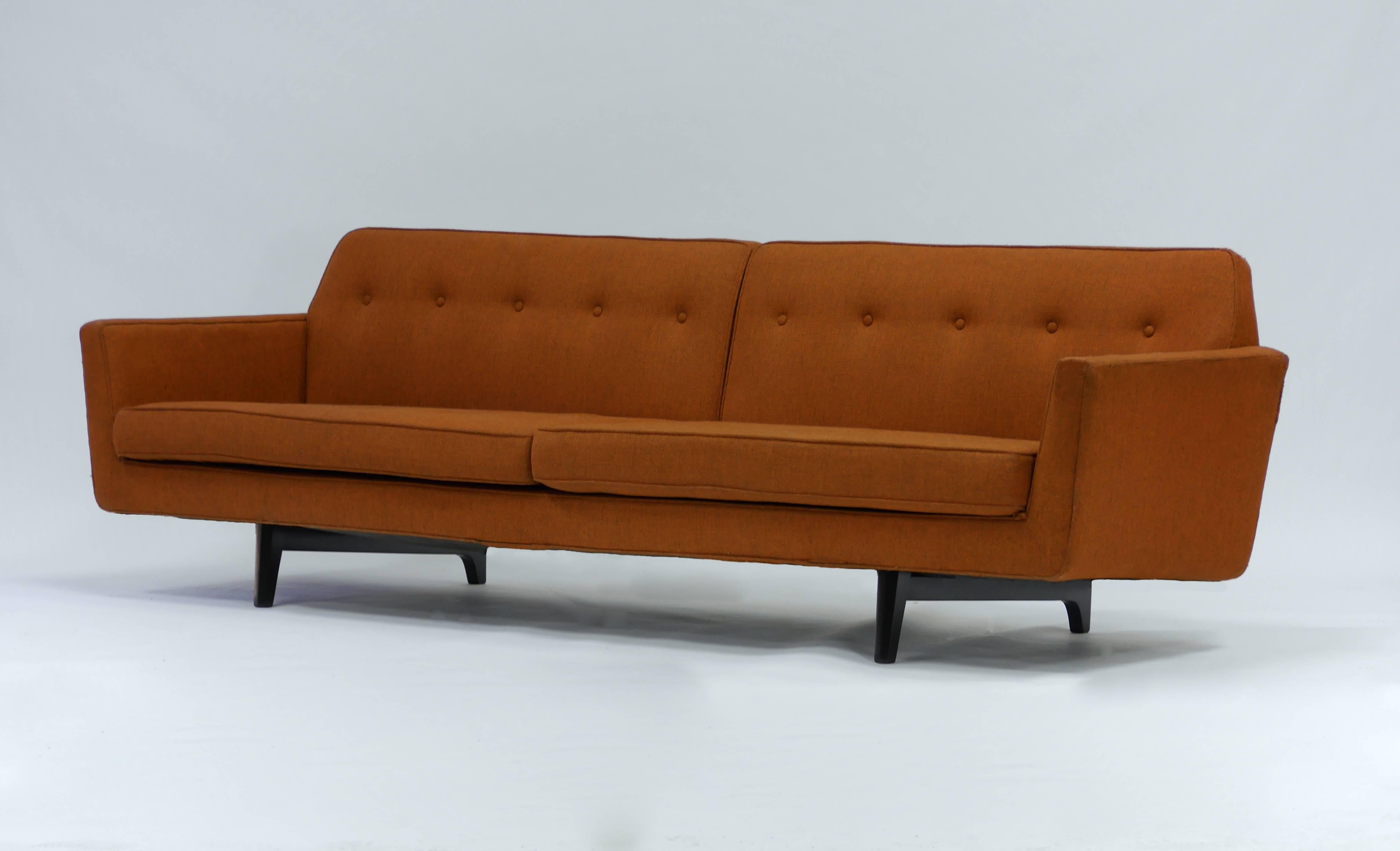 Pair of bracket back sofas by Edward Wormley for Dunbar. Original upholstery and wood elements have been refinished.