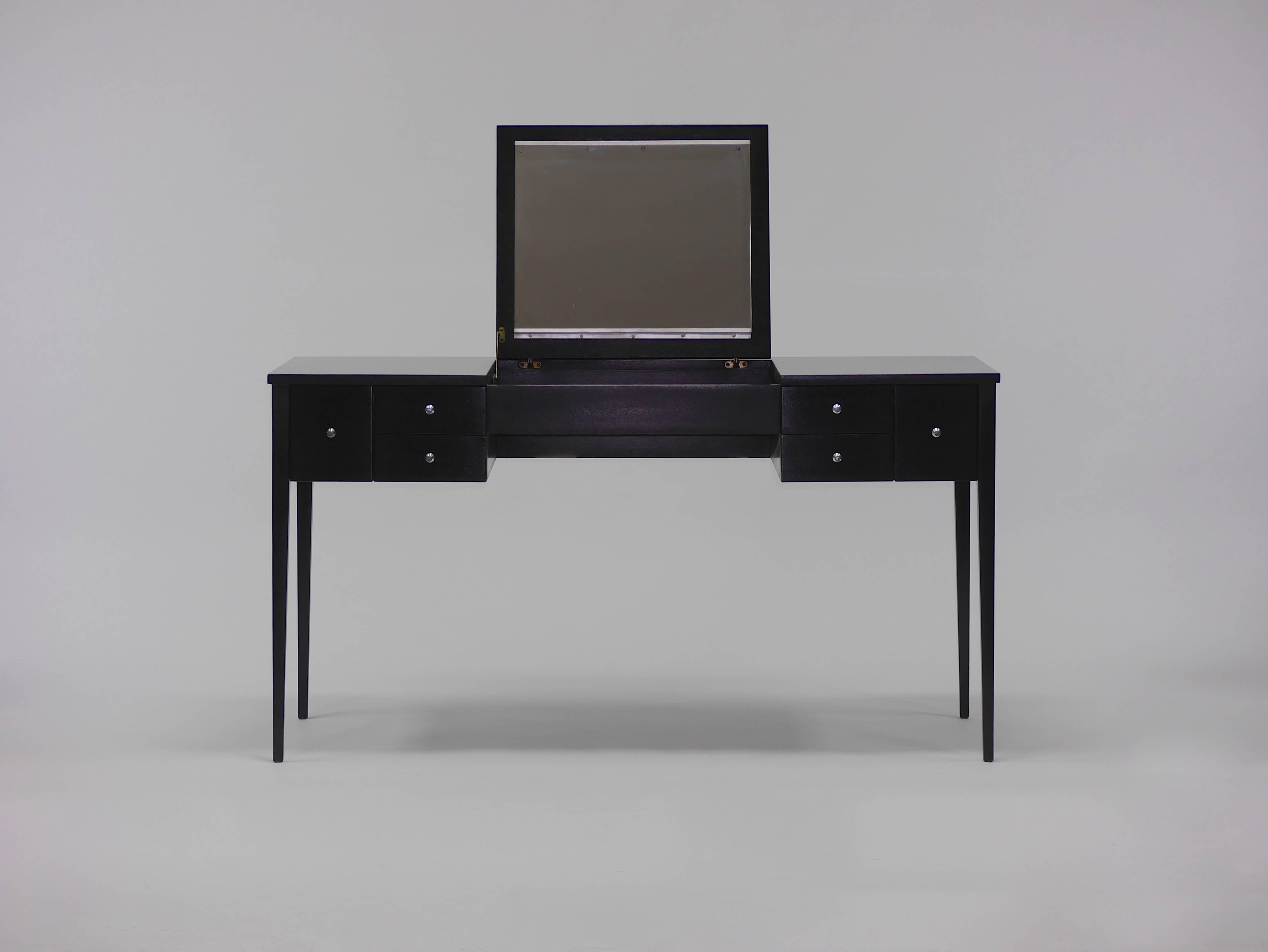 Elegant vanity desk by Paul McCobb for Calvin. Originally designed as a vanity, the flip-top compartment can be used to store laptops and office accessories. Refinished in a dark walnut lacquer. Six drawers with original pulls. Marked Paul McCobb,