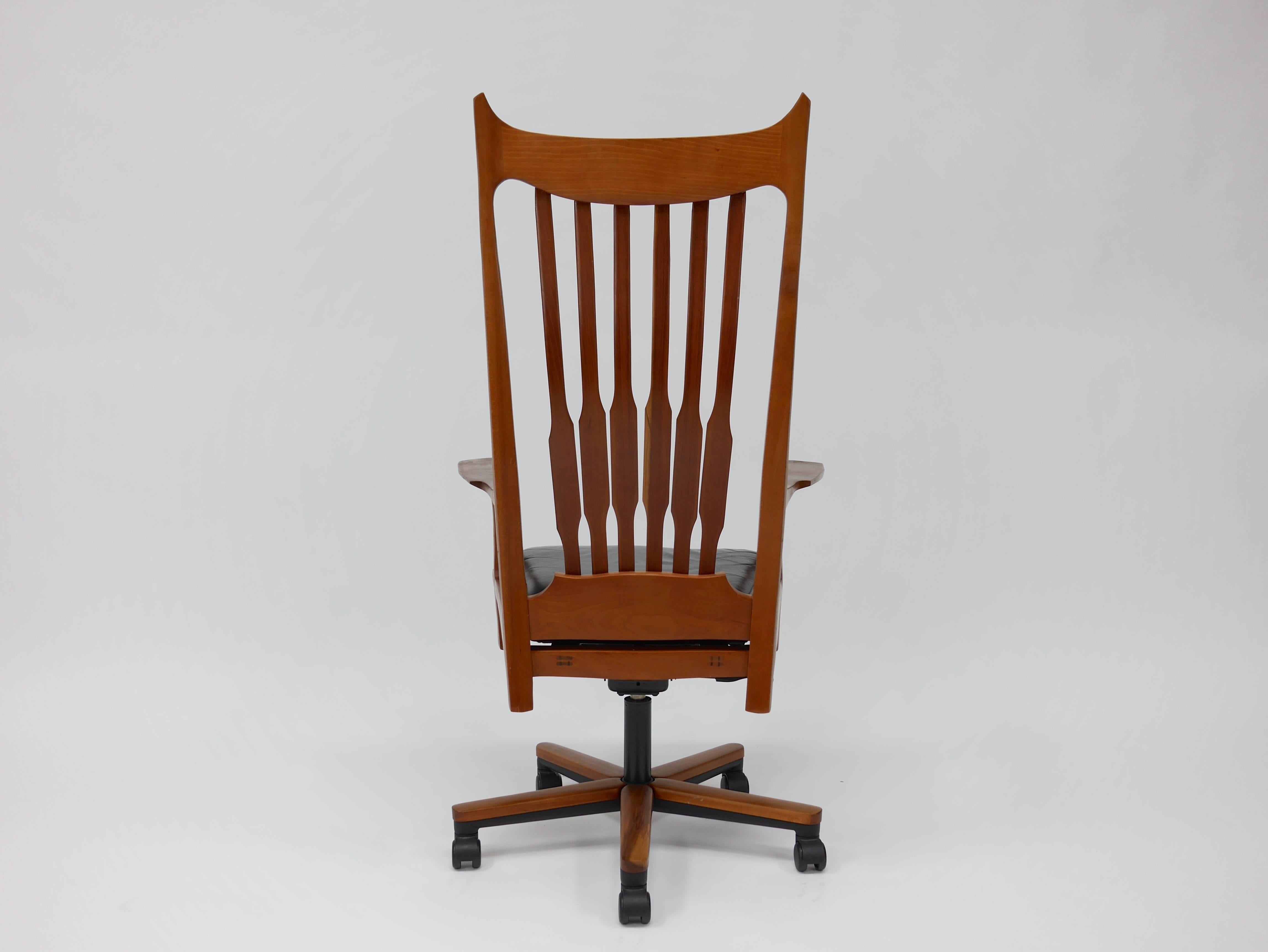 Studio movement office chair attributed to John Nyquist. Dramatic lines and spindle back with a leather upholstered seat. Through tenon joinery.
Measures approximately 28.5in wide x 21in deep x 51.5in tall (57in when fully raised), 20in seat height