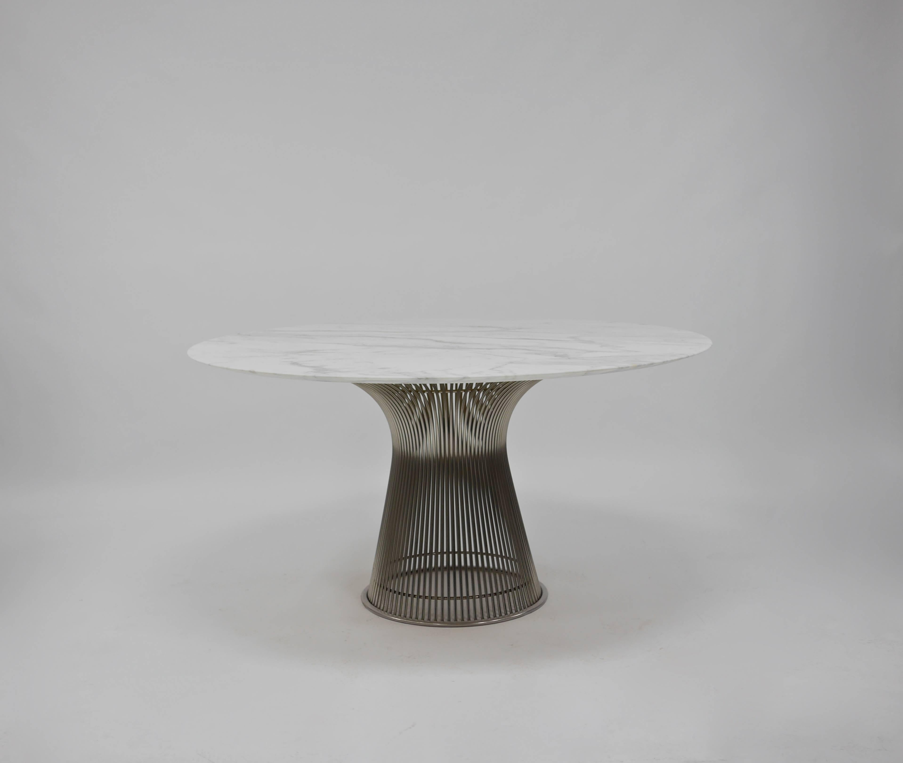Vintage marble dining table by Warren Platner for Knoll. Professionally honed and sealed Calacutta Gold Marble top. Nickel-plated steel base. Marked Knoll, circa 1960s.
Top has been professionally re honed to a matte finish and sealed. Free of