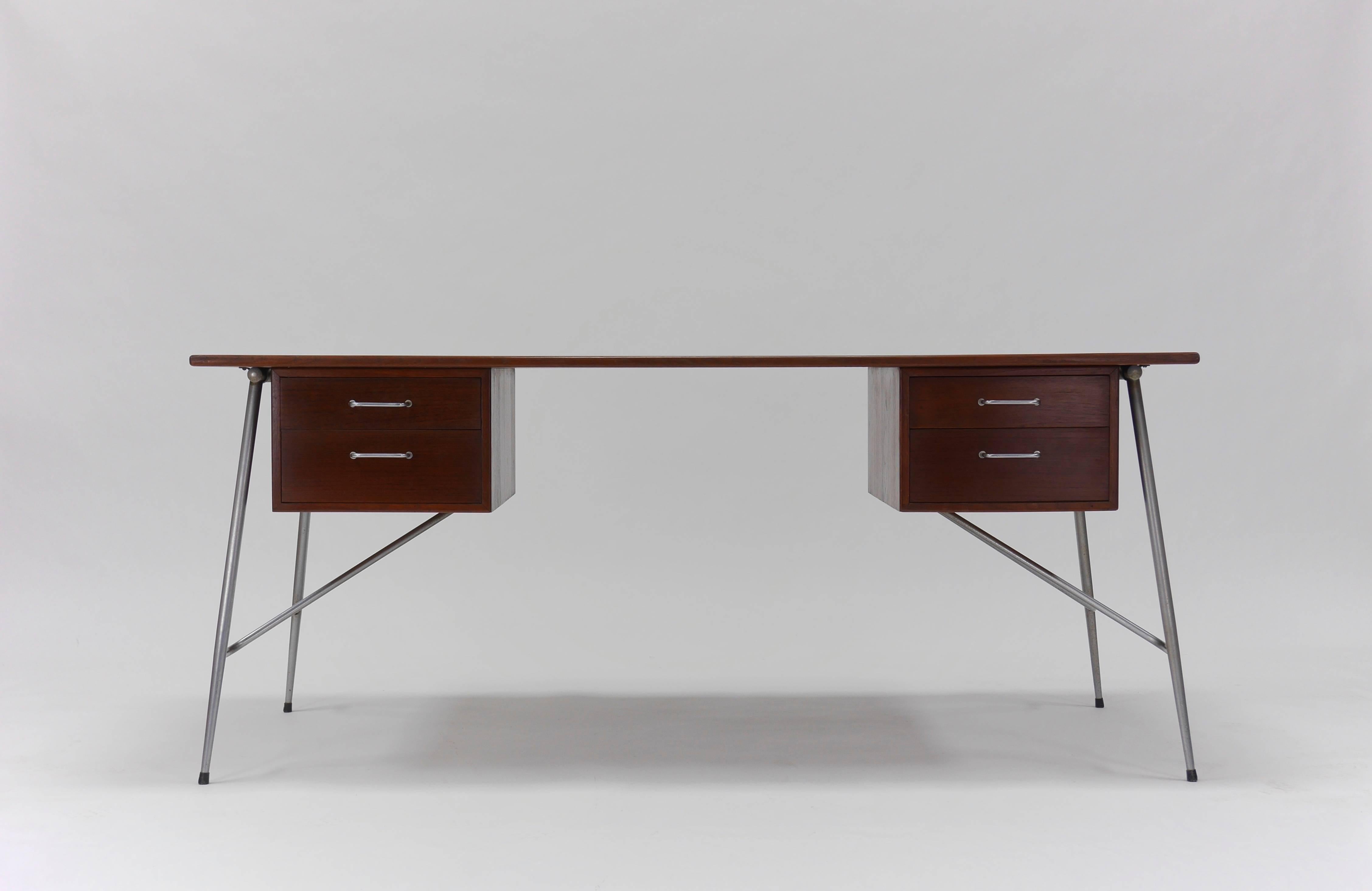 Rare to market, desk model 202 by Børge Mogensen for Soborg Mobelfabrik of Denmark, circa 1952. Having a large Teak writing surface, two pair of underhung drawers, and satin chrome legs. Very good original condition, showing even patina with light