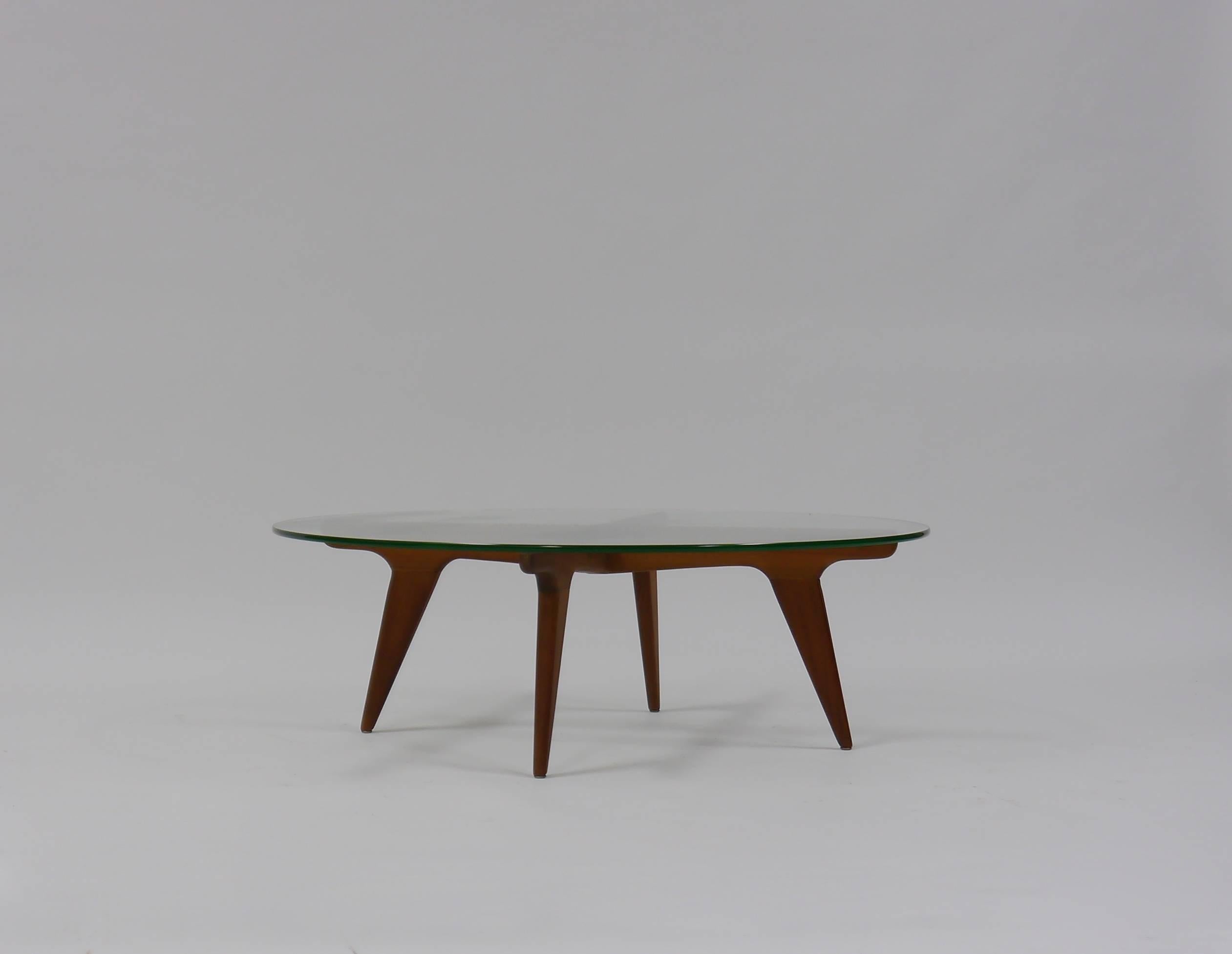 Well-made, black walnut coffee table in the manner of Gio Ponti.